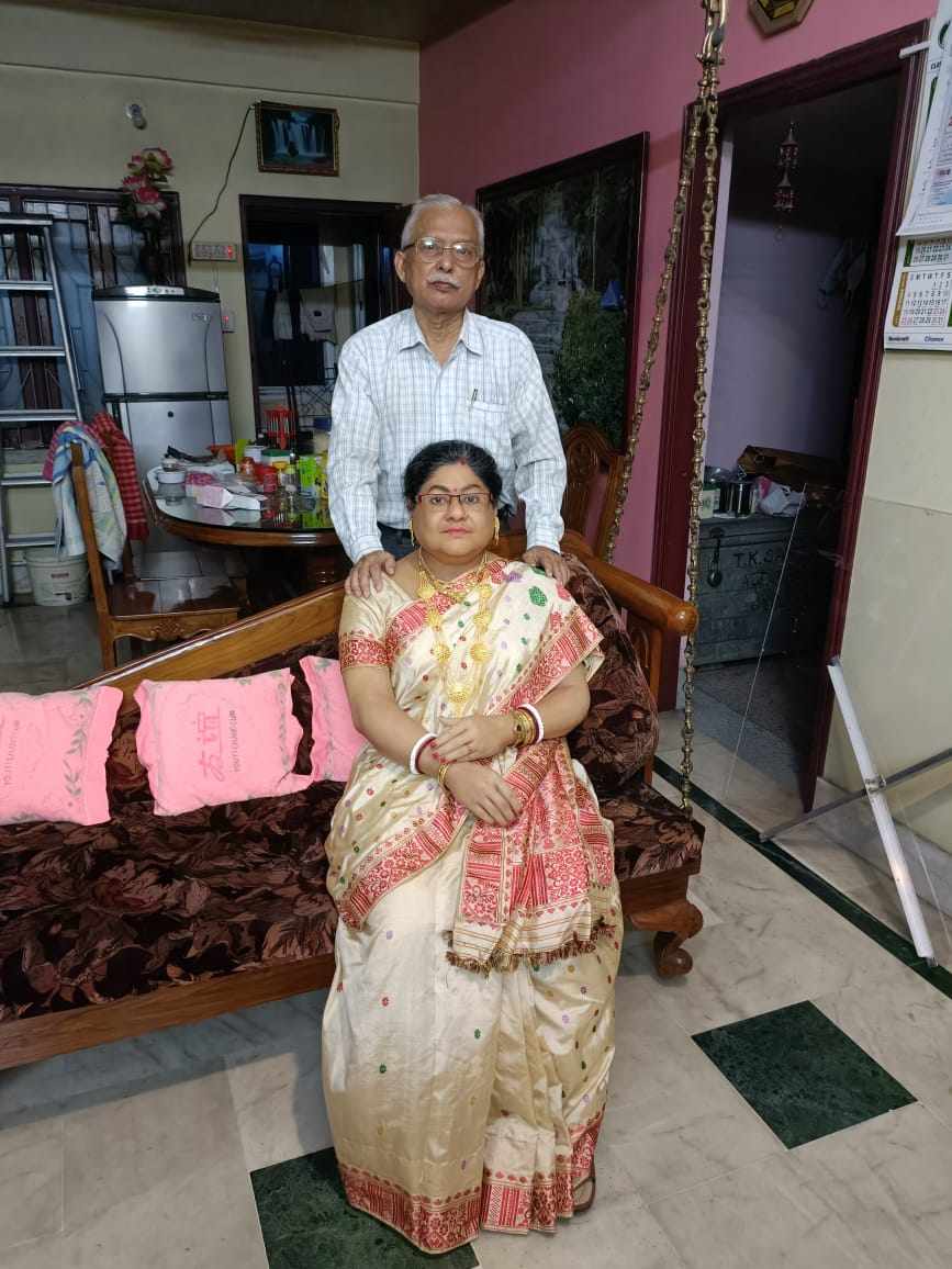 Tapas Sandilya stands behind a life-size figure of his late wife, Indrani Sandilya