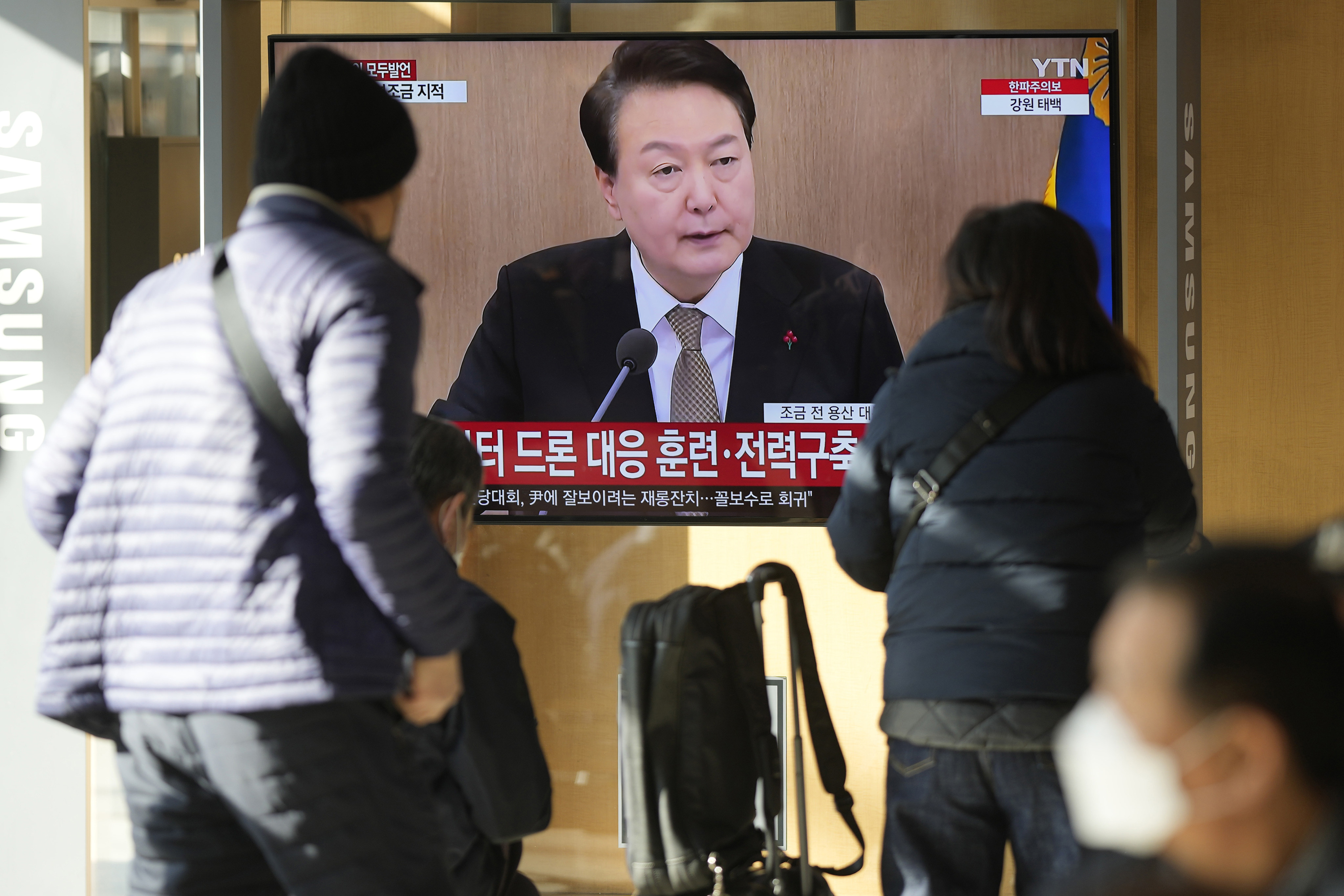 South Korean President Yoon Suk-yeol is shown on a TV screen in Seoul. Photo: AP/File
