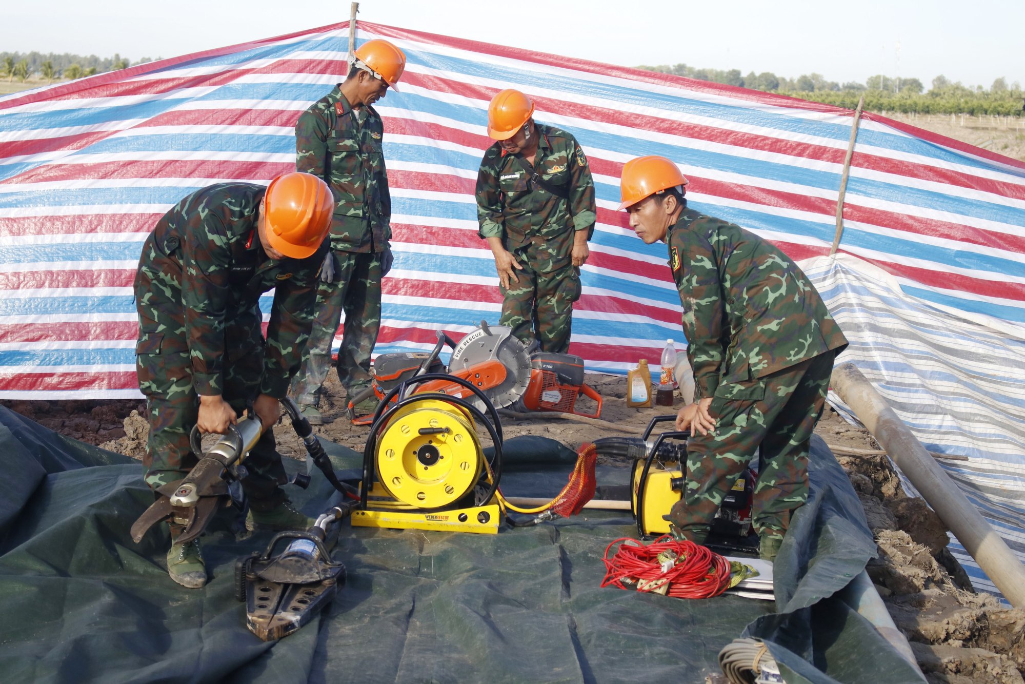 Soldiers work at the site on Wednesday where a 10-year-old boy fell into a 35-metre deep hole in Dong Thap Province, Vietnam. Photo: Vietnam News Agency via EPA-EFE