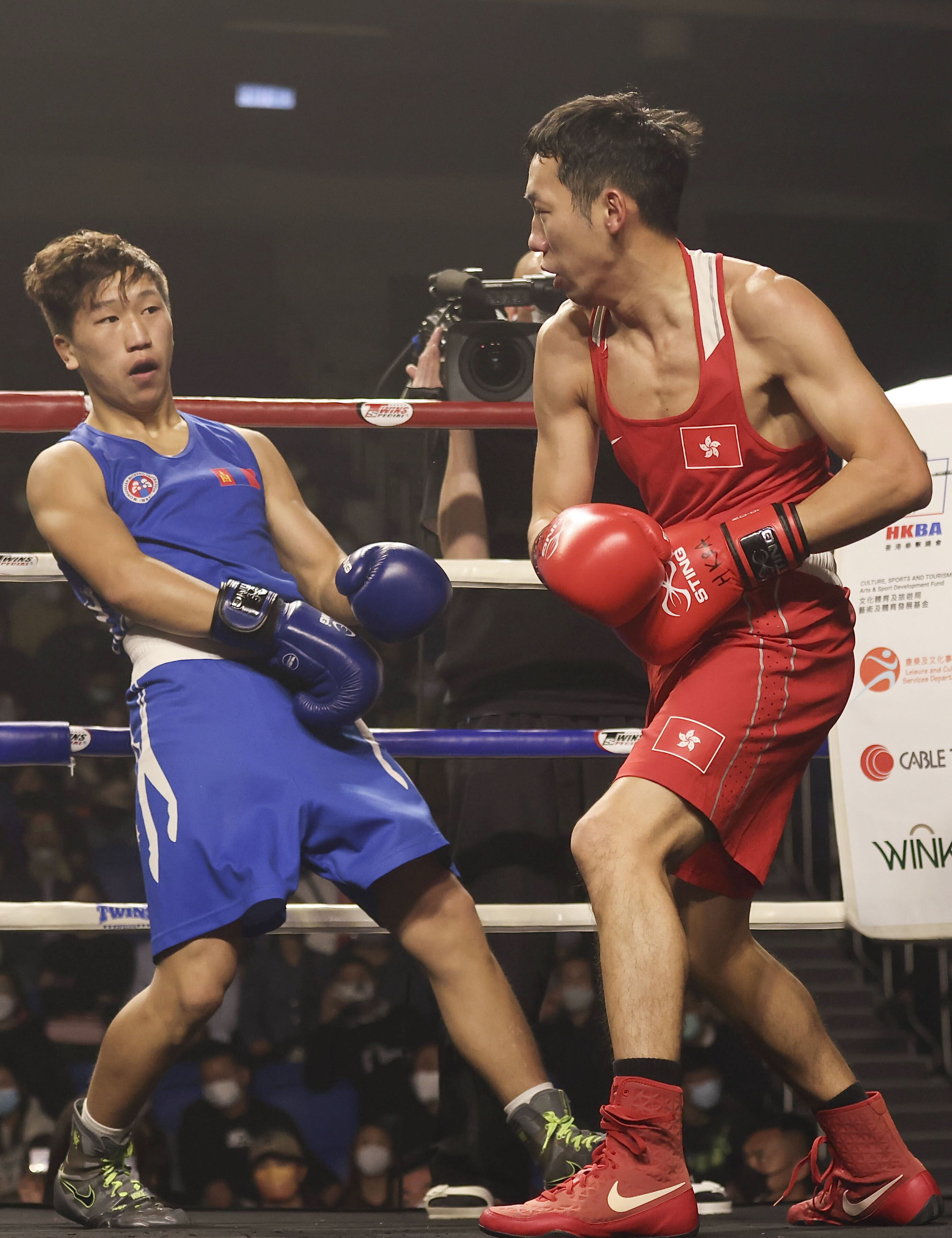 Hong Kong’s Rex Tso throws a punch at Mongolia’s Kharkuu Bilguunsaikhan at the Ultimate Extreme Fight Hong Kong 2023 event, at Southorn Stadium in Wan Chai. Photo: Jonathan Wong