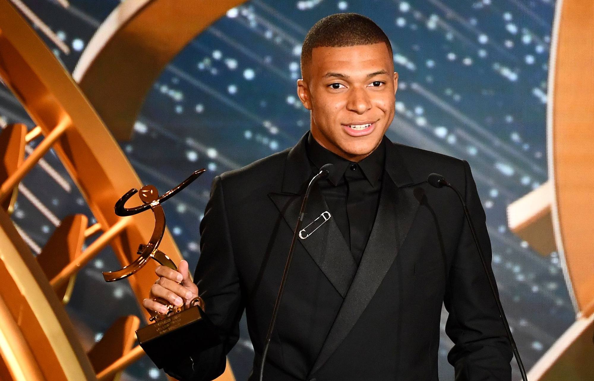 Paris Saint-Germain’s French forward Kylian Mbappé delivers a speech after receiving the best hope player award, in May 2019, in Paris, during the 28th edition of the UNFP (French National Professional Football players Union) trophy ceremony. Photo: AFP