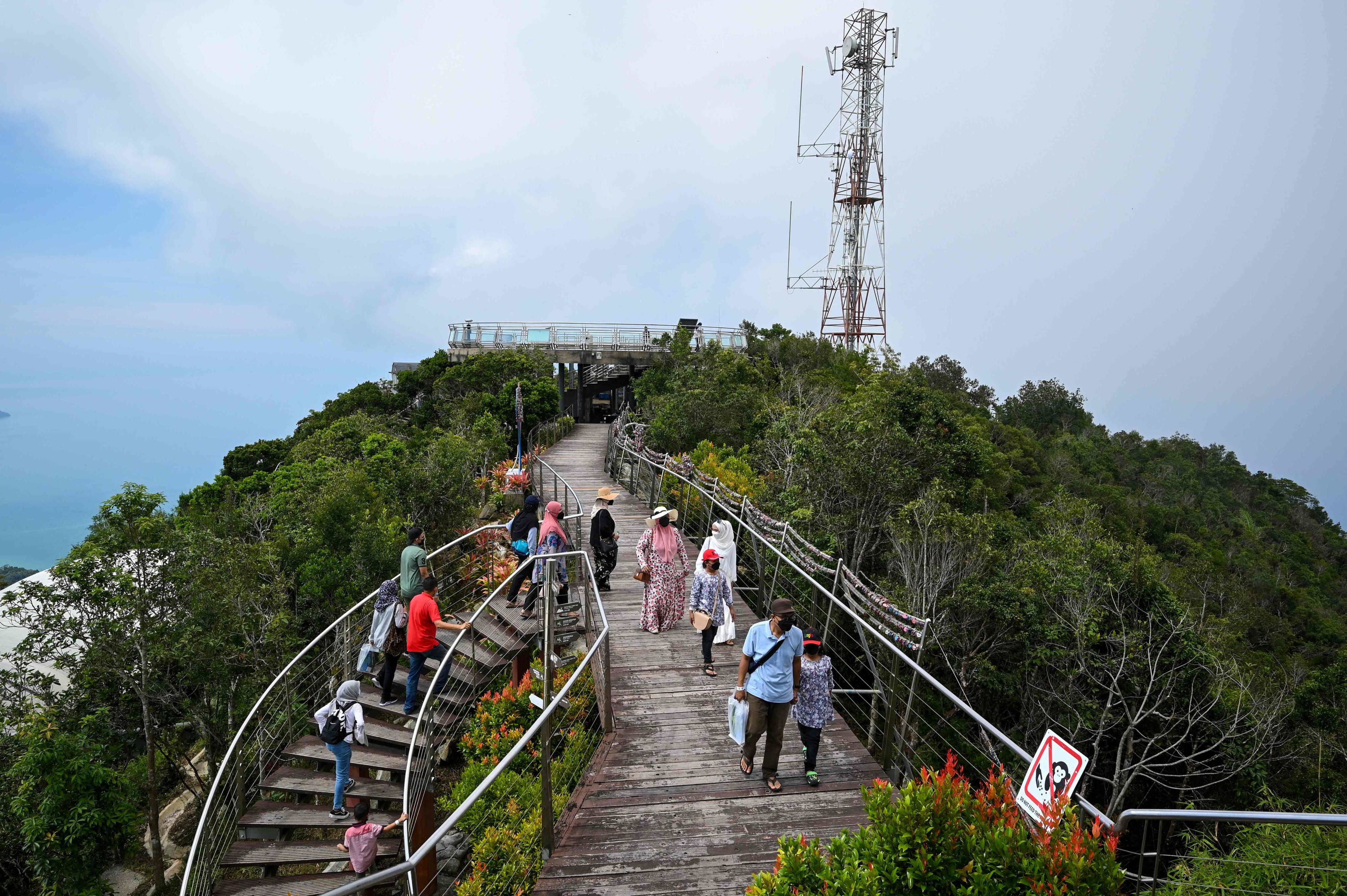 Visitors walk up to the lookout point near the Langkawi Skycab cable car. Photo: AFP 