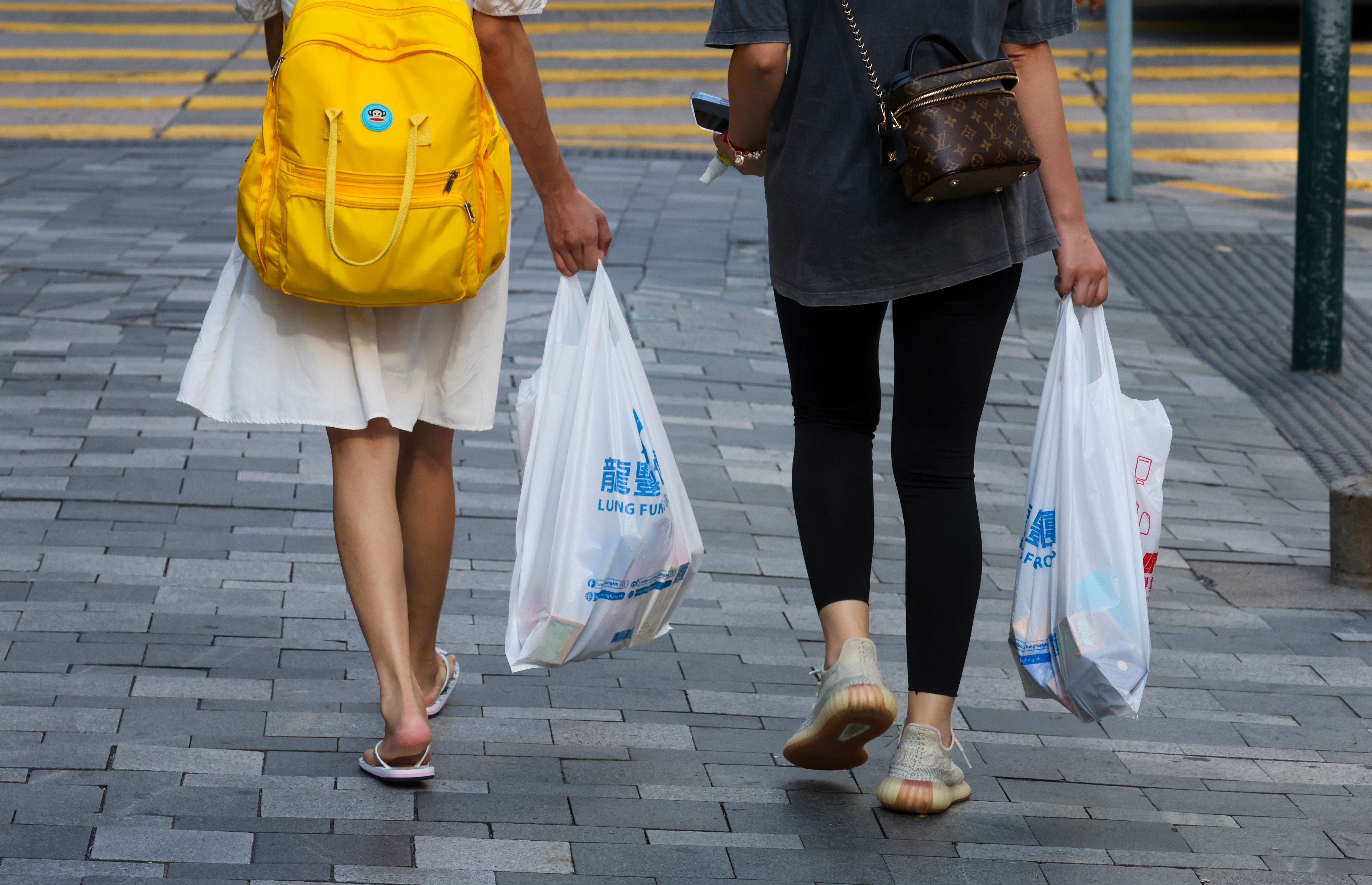 People with plastic bags in Tsim Sha Tsui on July 27. Photo: Edmond So