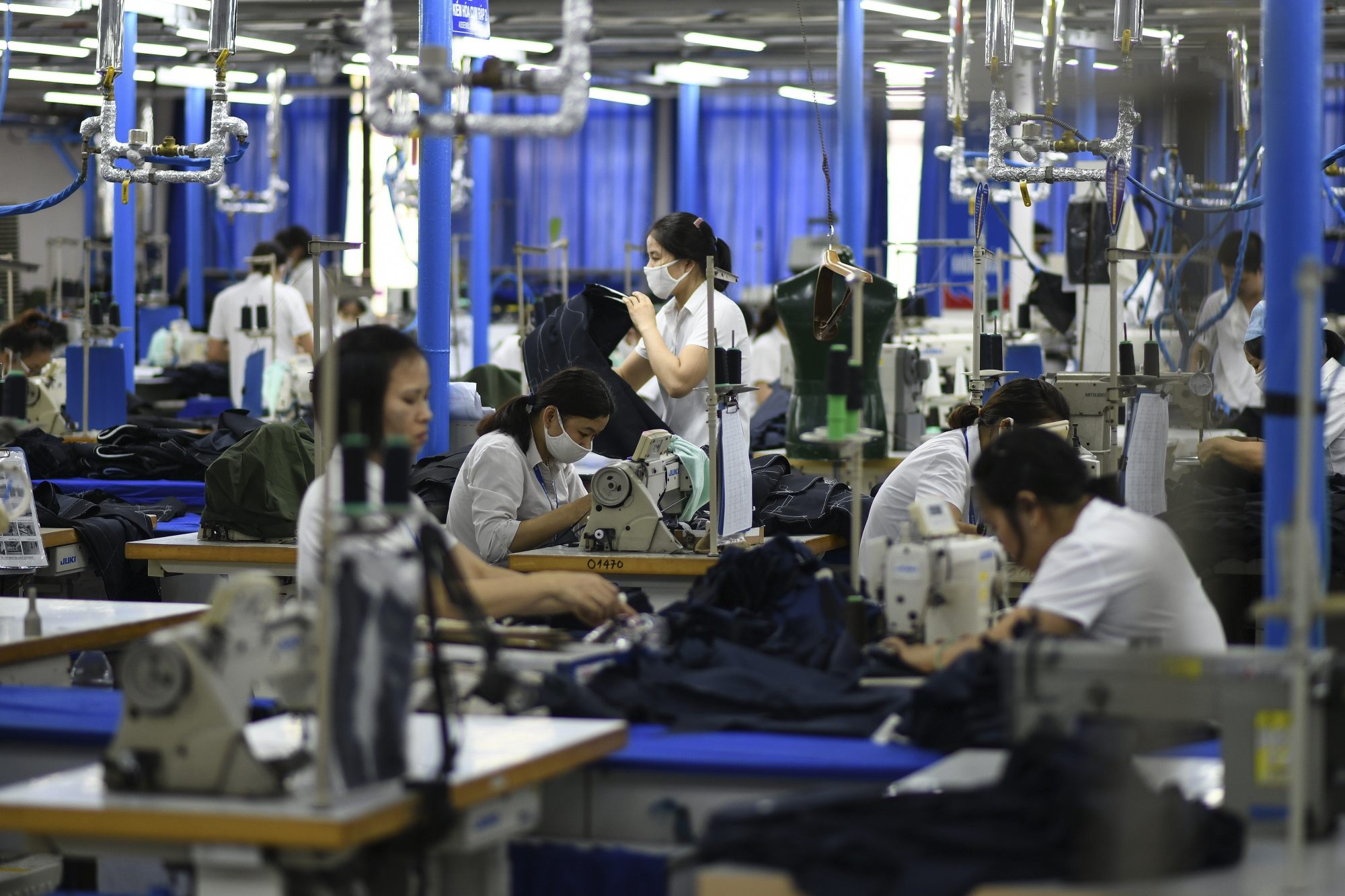 Workers make men’s suits at a garment factor in Hanoi. Vietnam is the world’s No 2 exporter of textiles and garments behind China. Photo: AFP