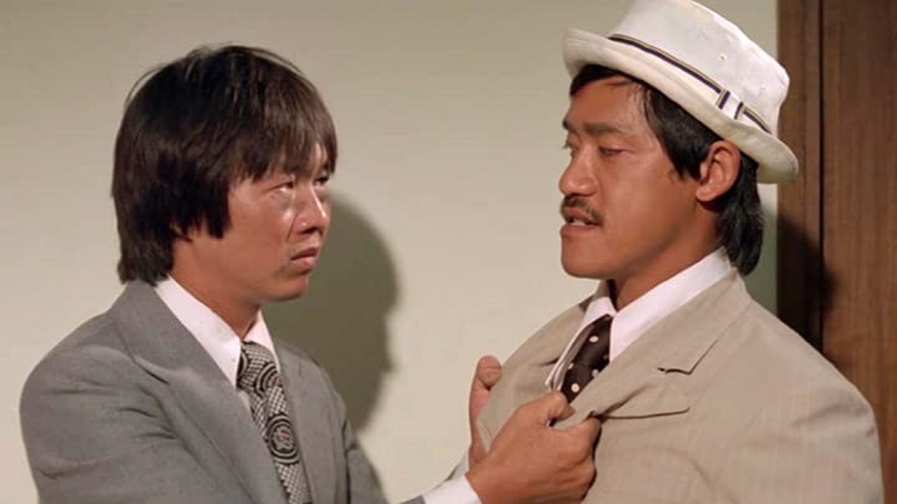 Ricky Hui (left) and Richard Ng in a still from Money Crazy (1977).