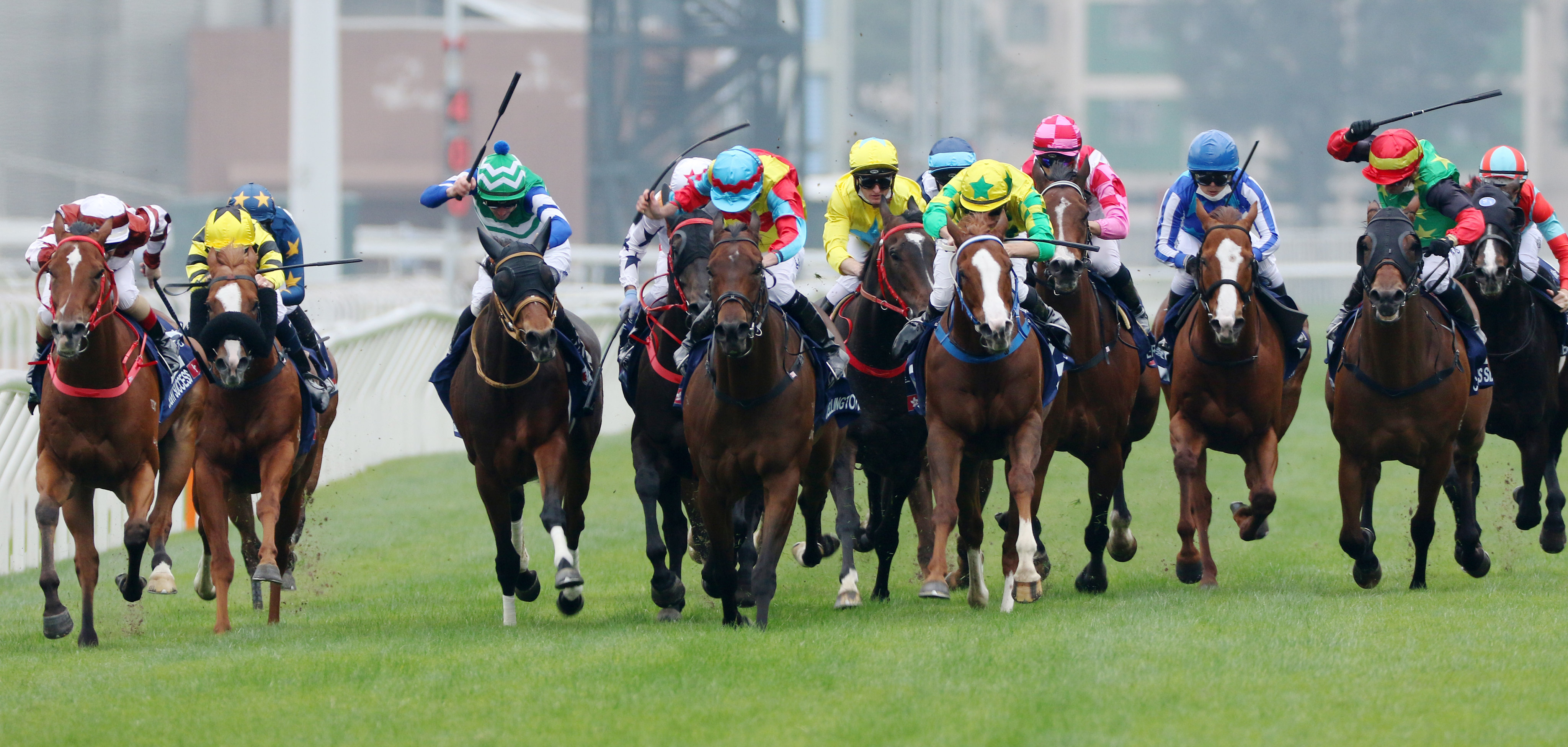 Wellington (pale blue cap) wins the messy Group One Hong Kong Sprint (1,200m) at Sha Tin on December 11. Photo: Kenneth Chan