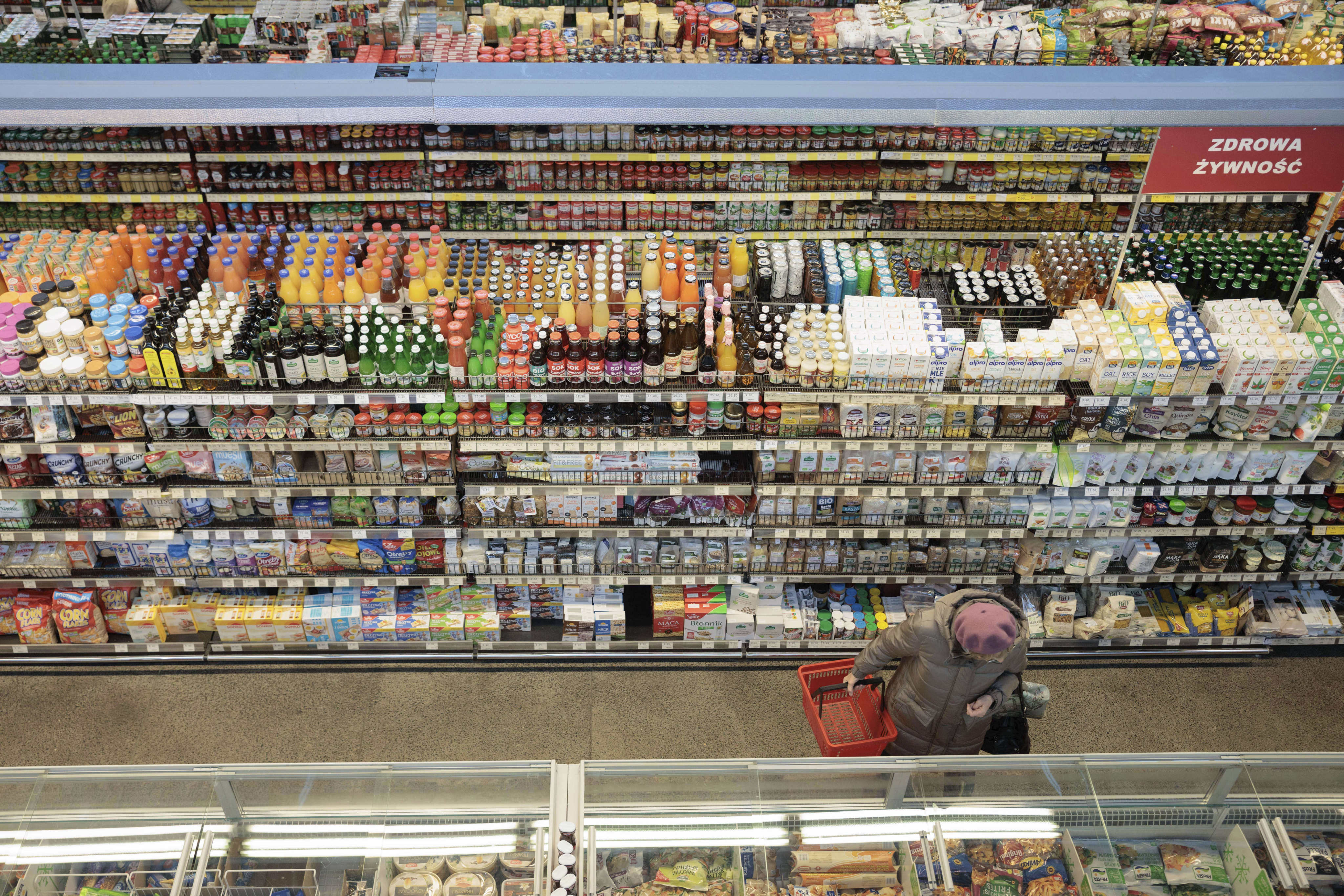 A shopper in a supermarket in Warsaw, Poland, on December 9, 2022. Since the second quarter of 2021, much of the world has been experiencing inflation far above 2 per cent. Photo: AP