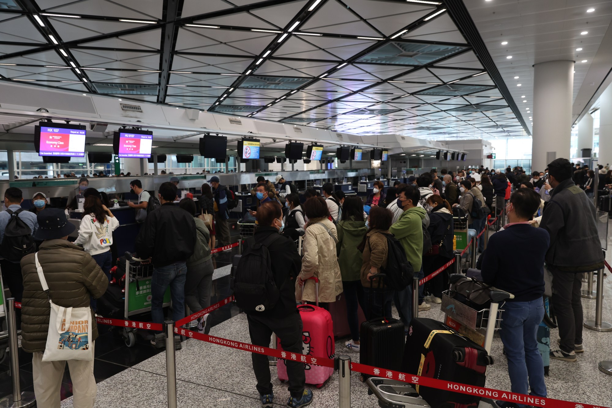 Passengers queue up to check in for flights to the mainland at Hong Kong International Airport. Photo: Yik Yeung-man