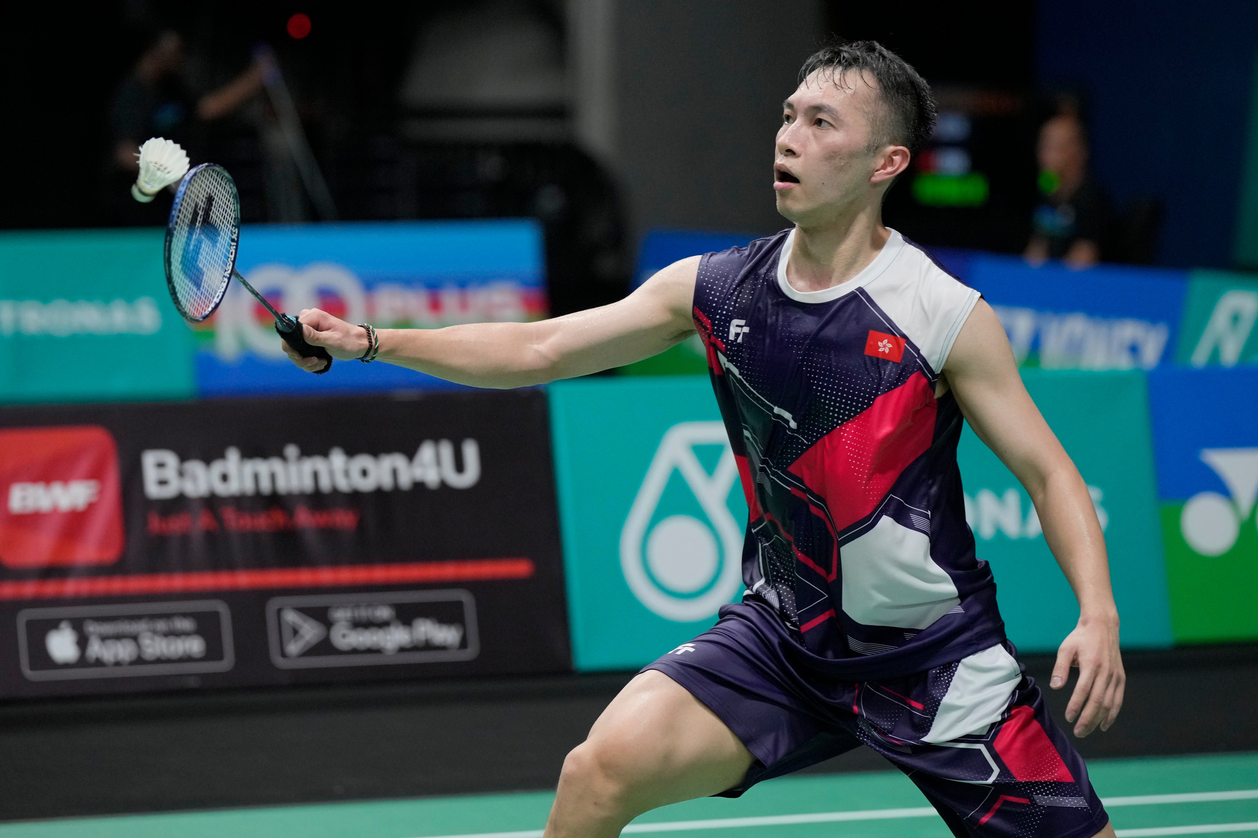 Hong Kong’s Angus Ng plays a shot against Indonesia’s Anthony Sinisuka Ginting during their men’s singles match at the Malaysia Open. Photo: AP