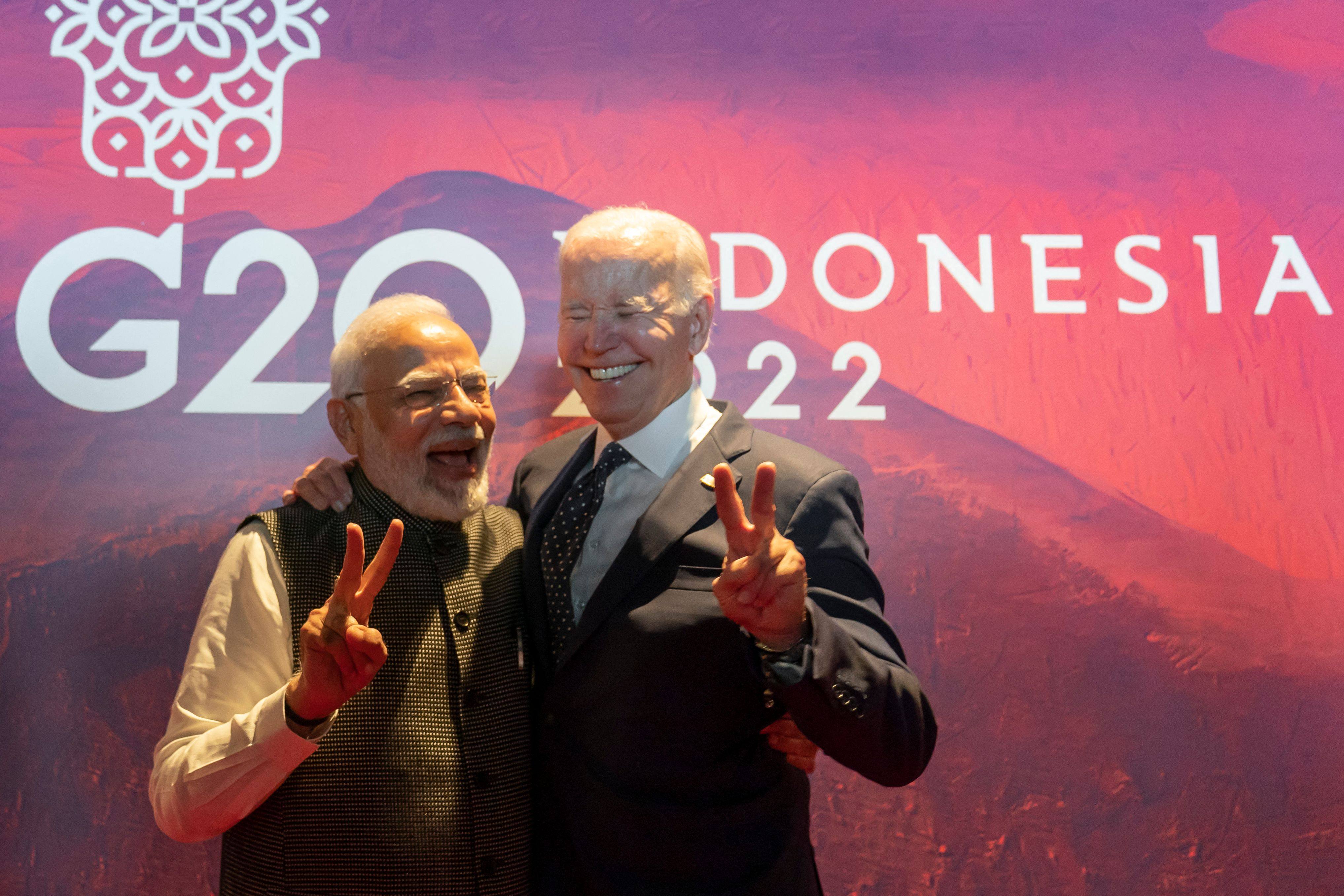 India’s Prime Minister Narendra Modi and US President Joe Biden pose for pictures before the Partnership for Global Infrastructure and Investment meeting at the G20 Summit in Nusa Dua on the Indonesian resort island of Bali on November 15. Photo: AFP