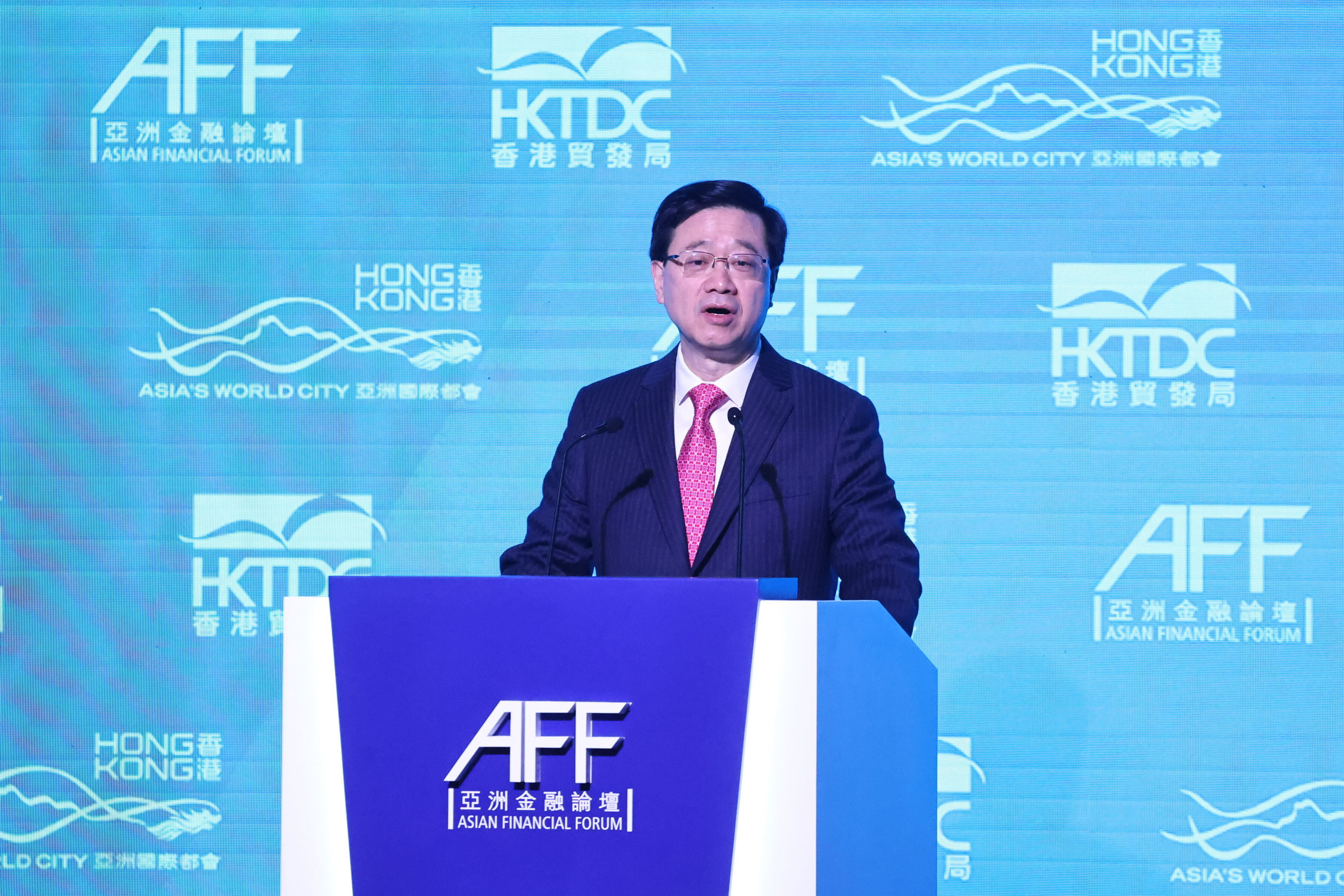 Chief Executive John Lee speaks at the Asian Financial Forum at the Hong Kong Convention and Exhibition Centre in Wan Chai on January 11. Lee promised to “go fast” on the city’s return to normal. Photo: K.Y. Cheng