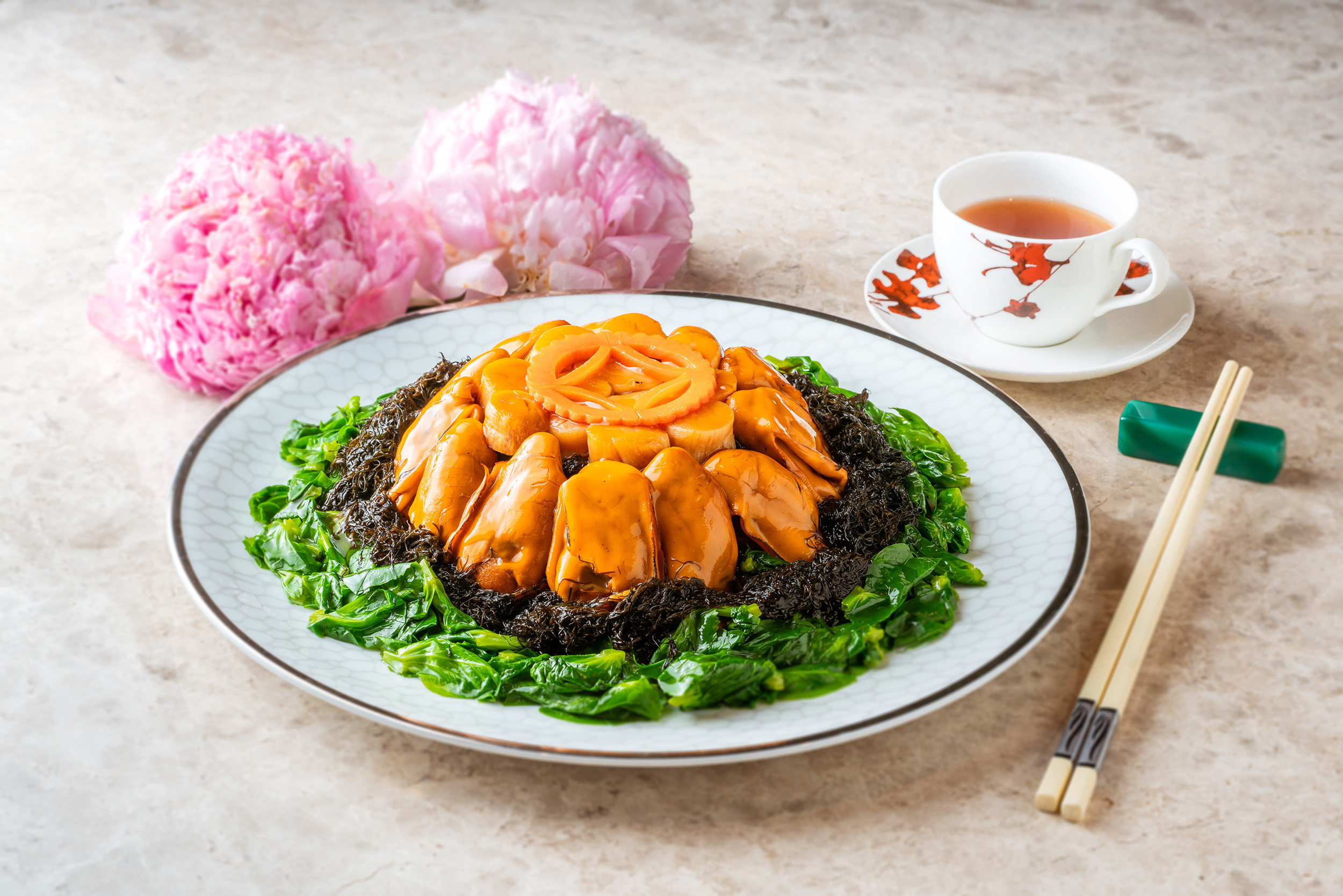 Braised whole conpoy with sea moss and sun-dried oyster at Ying Jee Club in Hong Kong, one of our picks of restaurants with the best Lunar New Year 2023 menus. Photo: Ying Jee Club