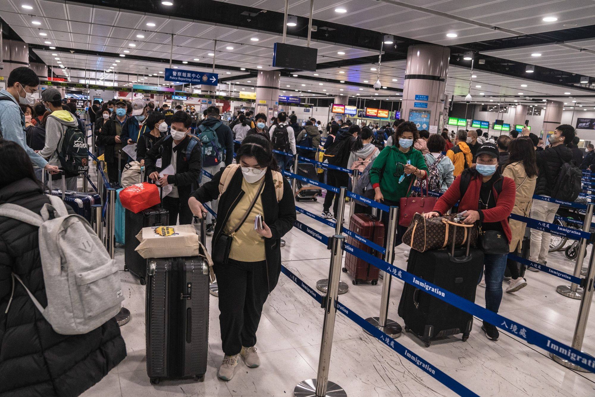 Travellers queue in the border control area at Lok Ma Chau station on January 8, the first day the border with the mainland was reopened for quarantine-free travel. Photo: Bloomberg