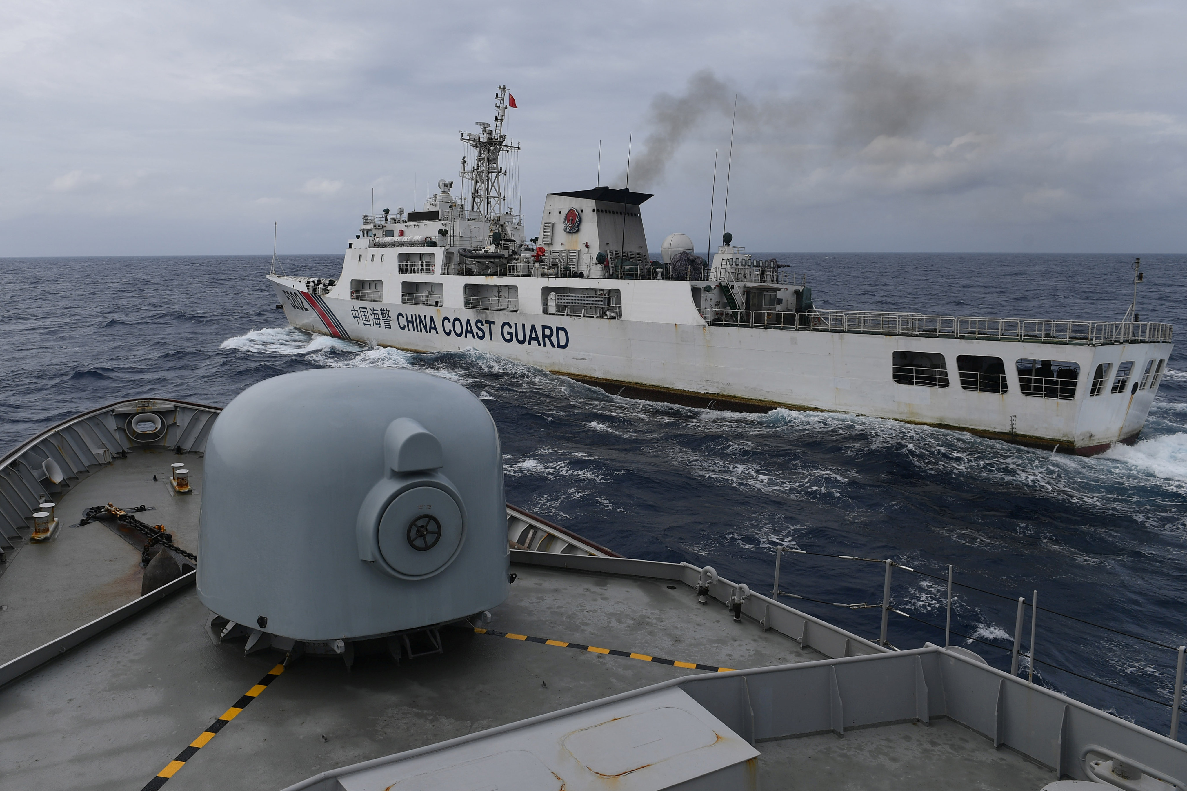 A China Coast Guard ship is seen from an Indonesian naval vessel during a patrol at Indonesia’s exclusive economic zone sea north of the Natuna Islands in January 2020. Photo: Antara Foto via Reuters