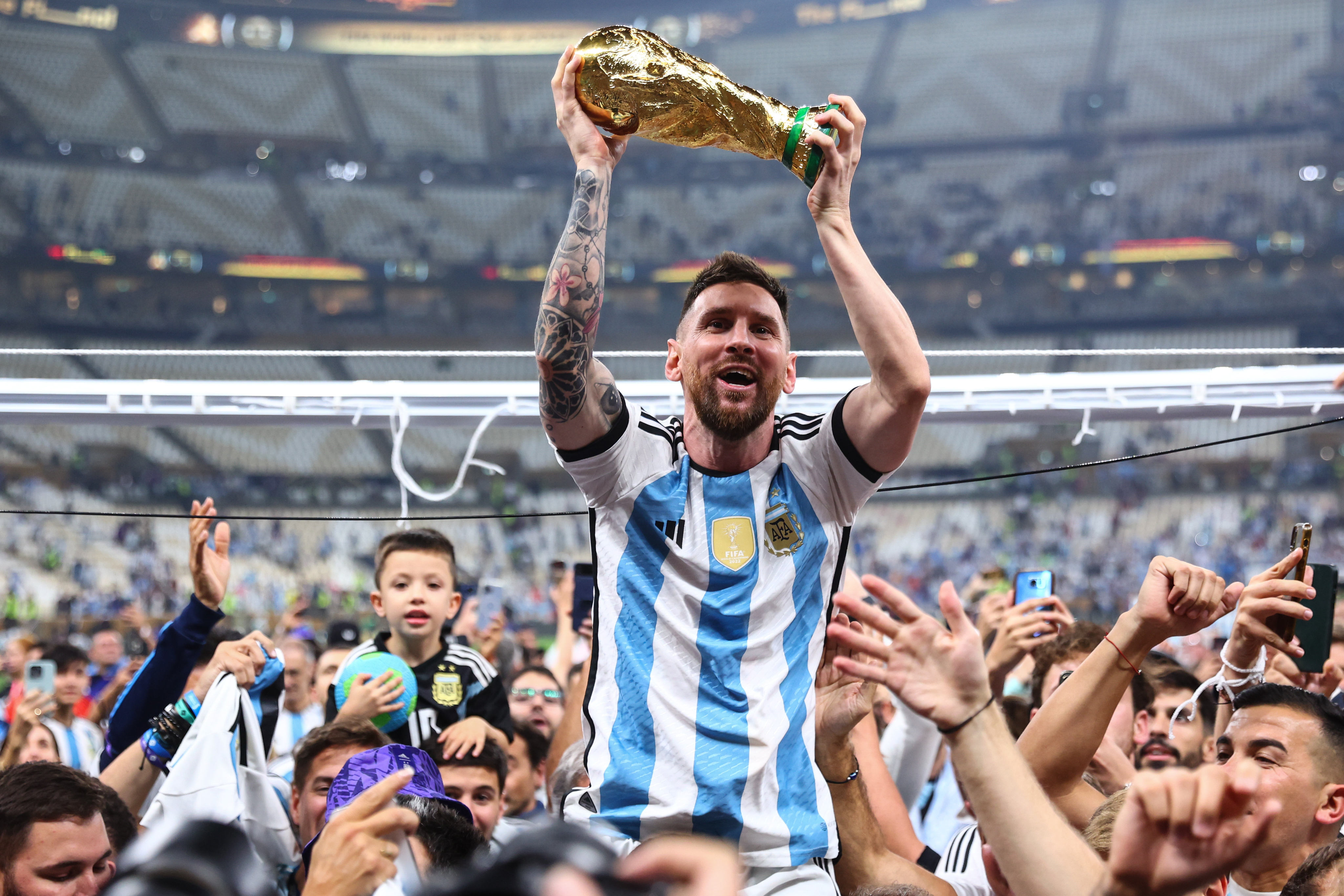 Argentina’s Lionel Messi celebrates with the World Cup trophy after his side’s victory over France in the final in Qatar. Photo: DPA