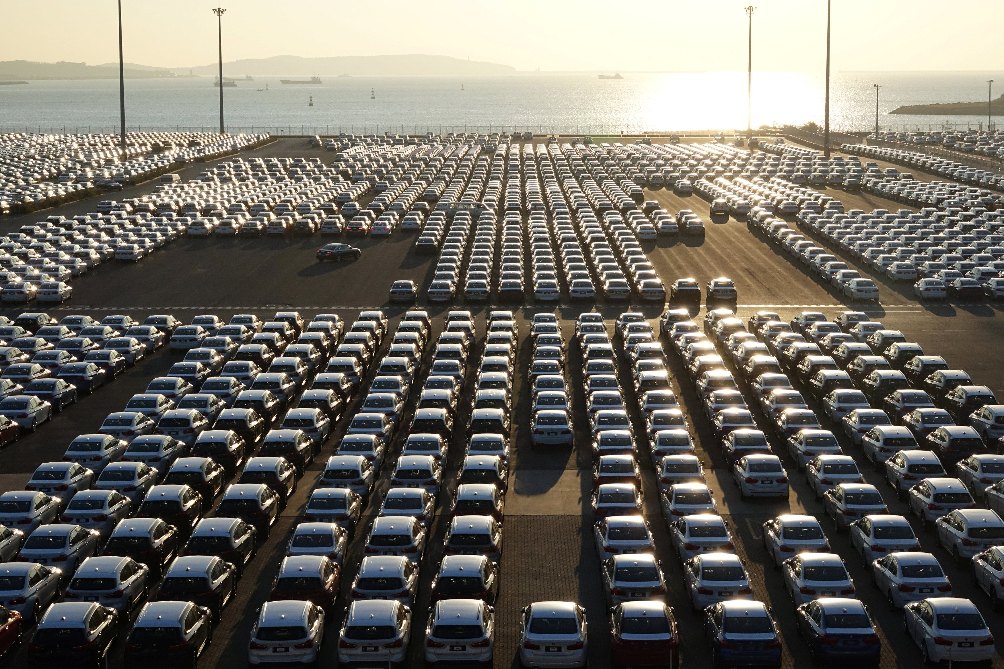 New cars are seen at the automobile terminal in the port of Dalian, Liaoning province, China on October 18, 2018. Photo: Reuters