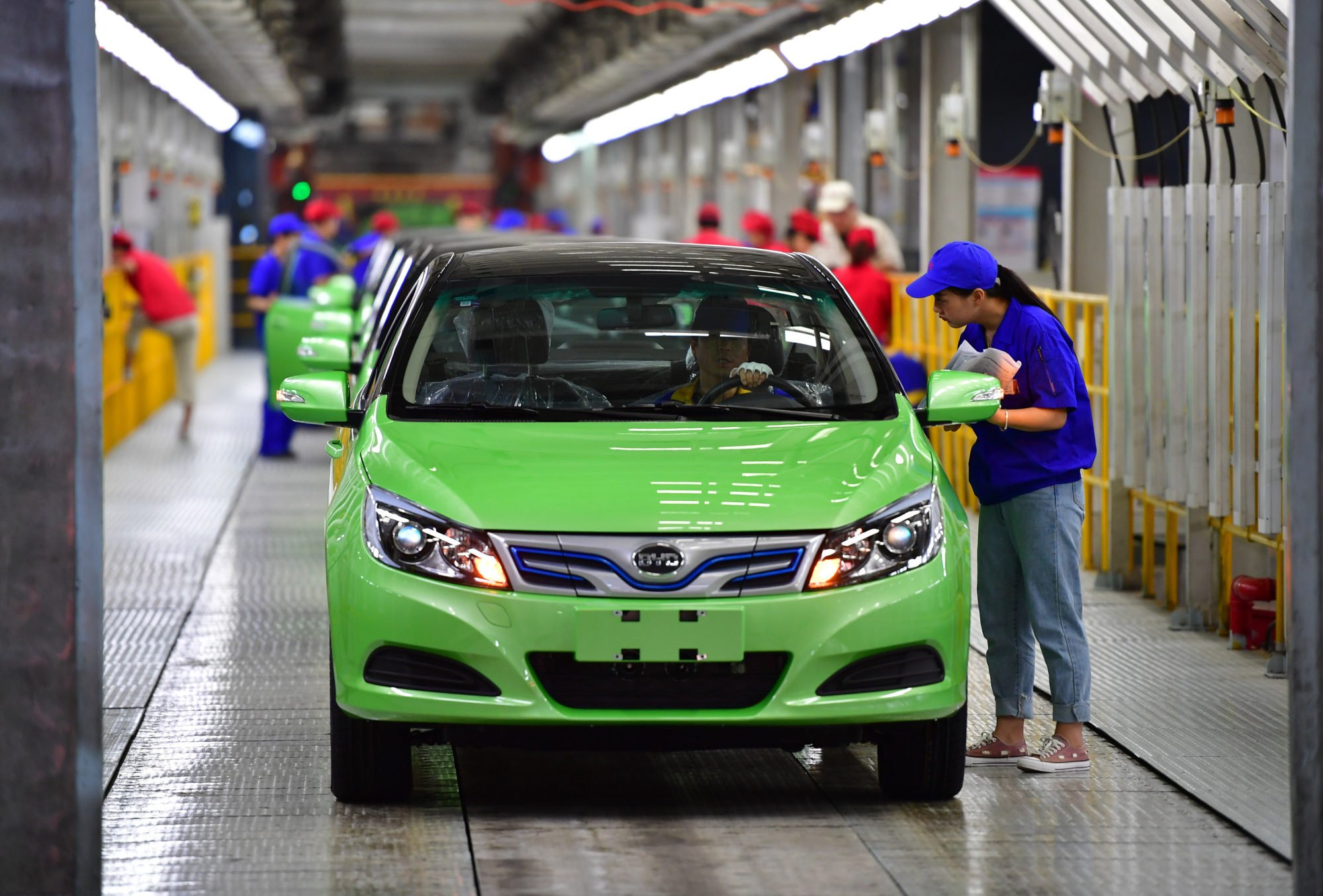 Workers check BYD electric cars on a manufacturing line in Xian in northwest China’s Shaanxi province in 2019. Photo: Xinhua