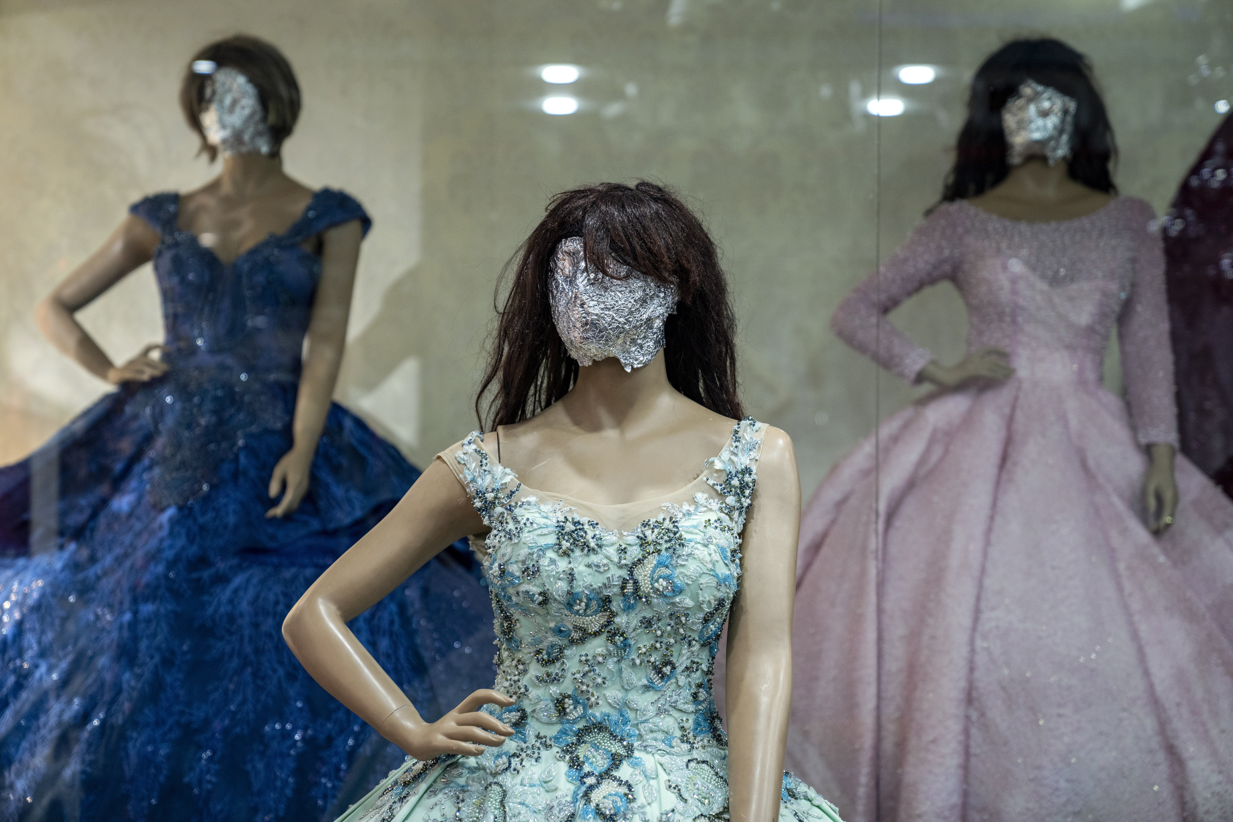 Mannequin’s heads are covered in a women’s dress store store in Kabul. Photo: AP 