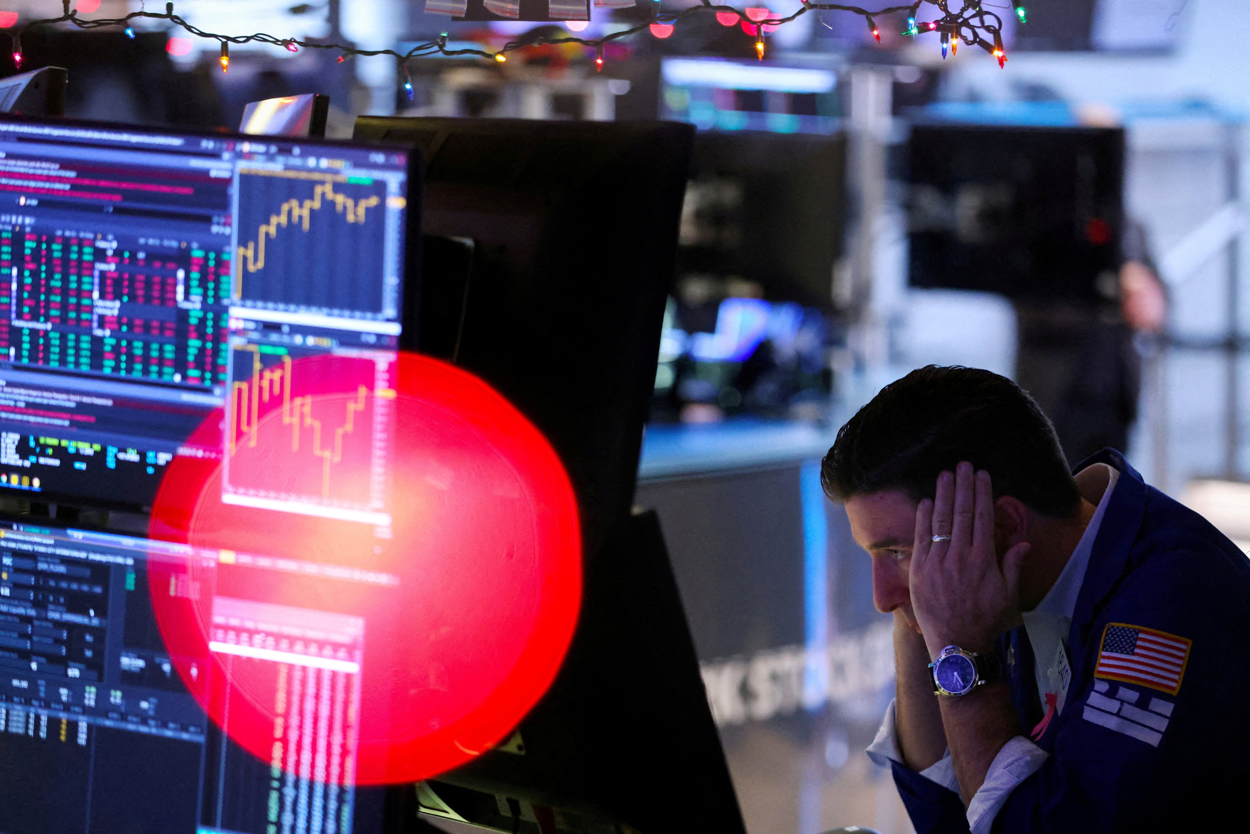 A trader works on the floor of the New York Stock Exchange on December 14. Doing nothing or playing it safe is not an option after the disastrous run for stocks in 2022. Photo: Reuters 
