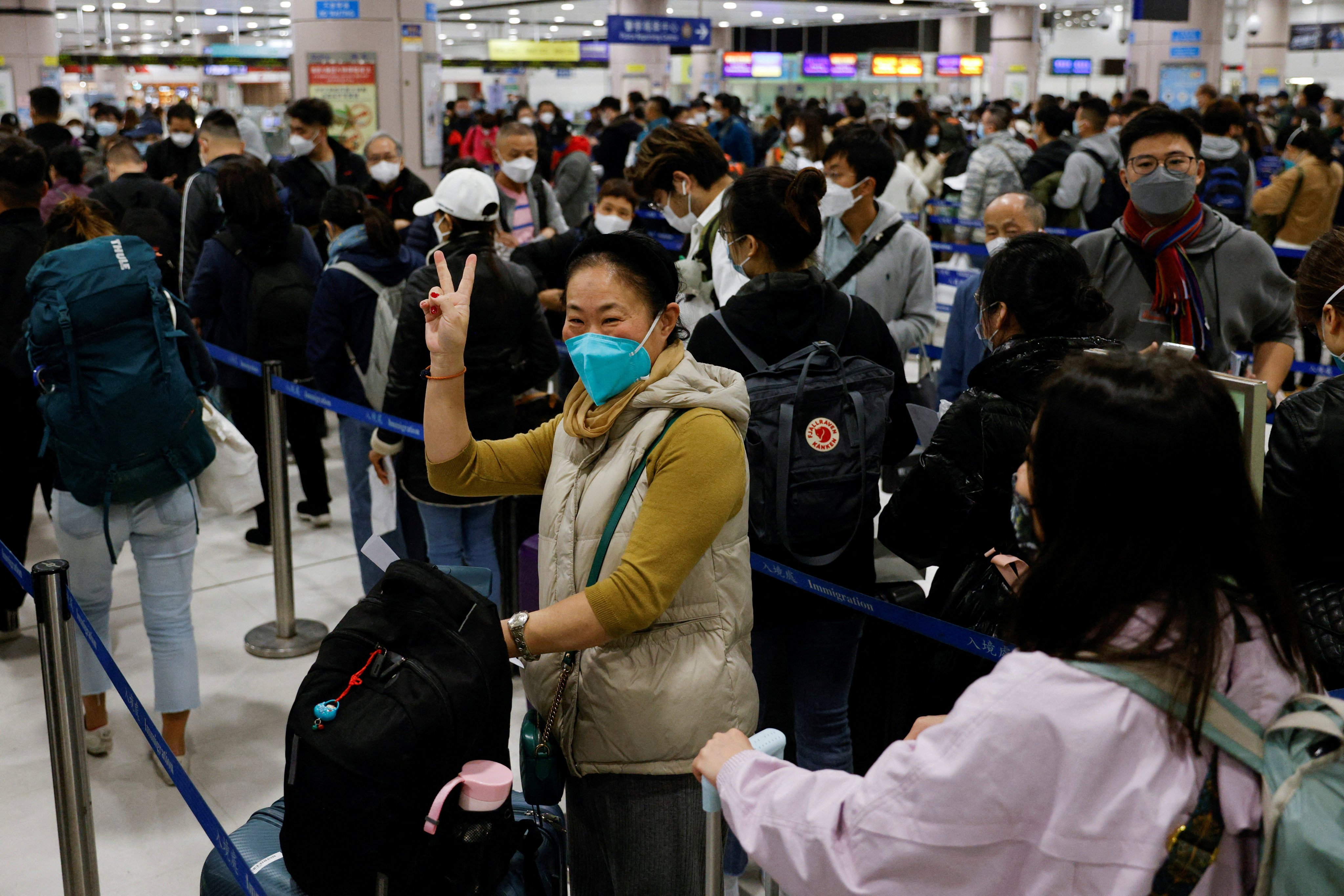 People queue at the Lok Ma Chau border checkpoint on January 8 as the Hong Kong-mainland border reopens to quarantine-free travel. The return of mainland tourists is a good sign for Hong Kong’s economy. Photo: Reuters