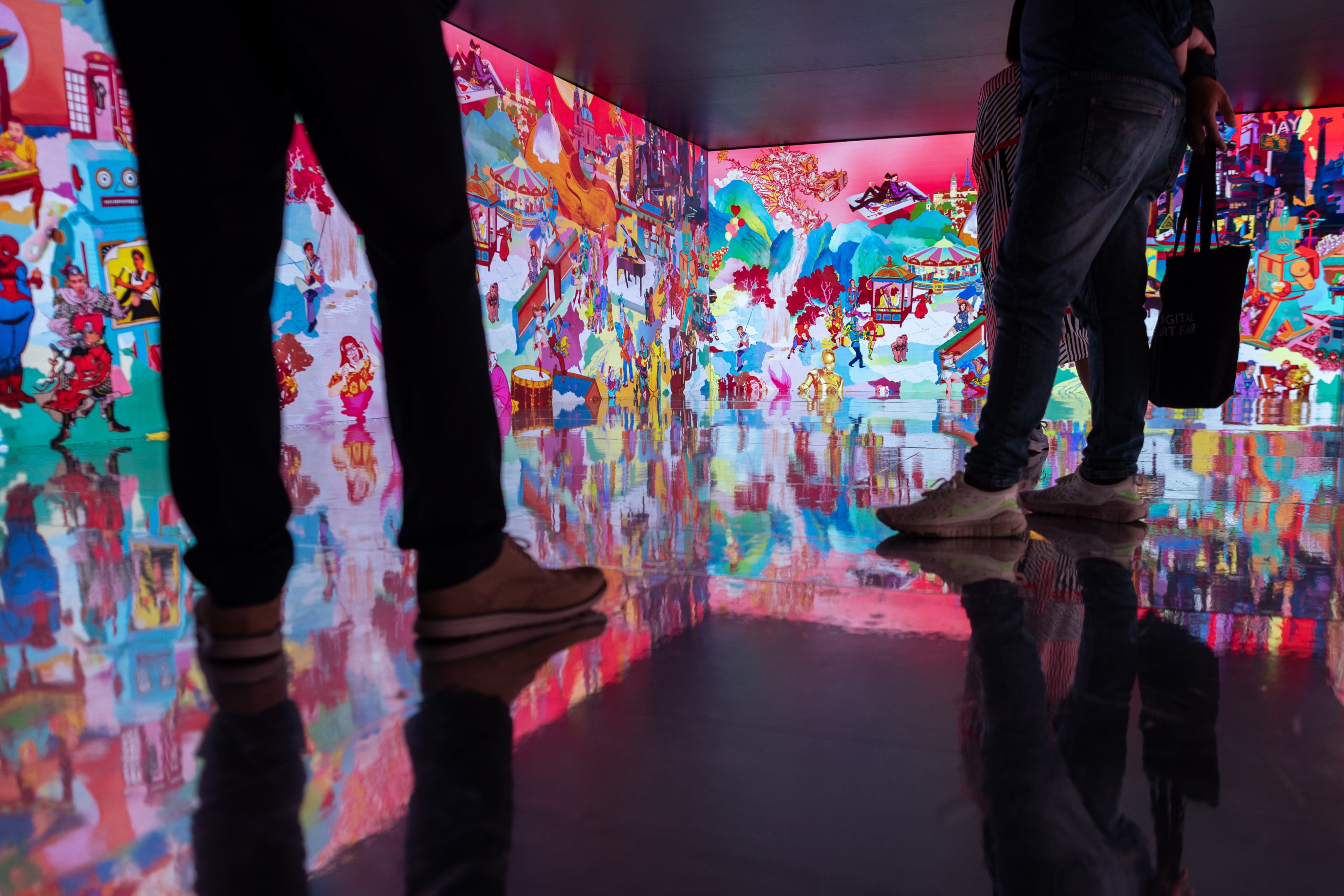 People visit the Digital Art Fair Xperience 2022 in Hong Kong on October 21, 2022. The fair includes digital works using technologies including blockchain and virtual reality. Photo: EPA-EFE