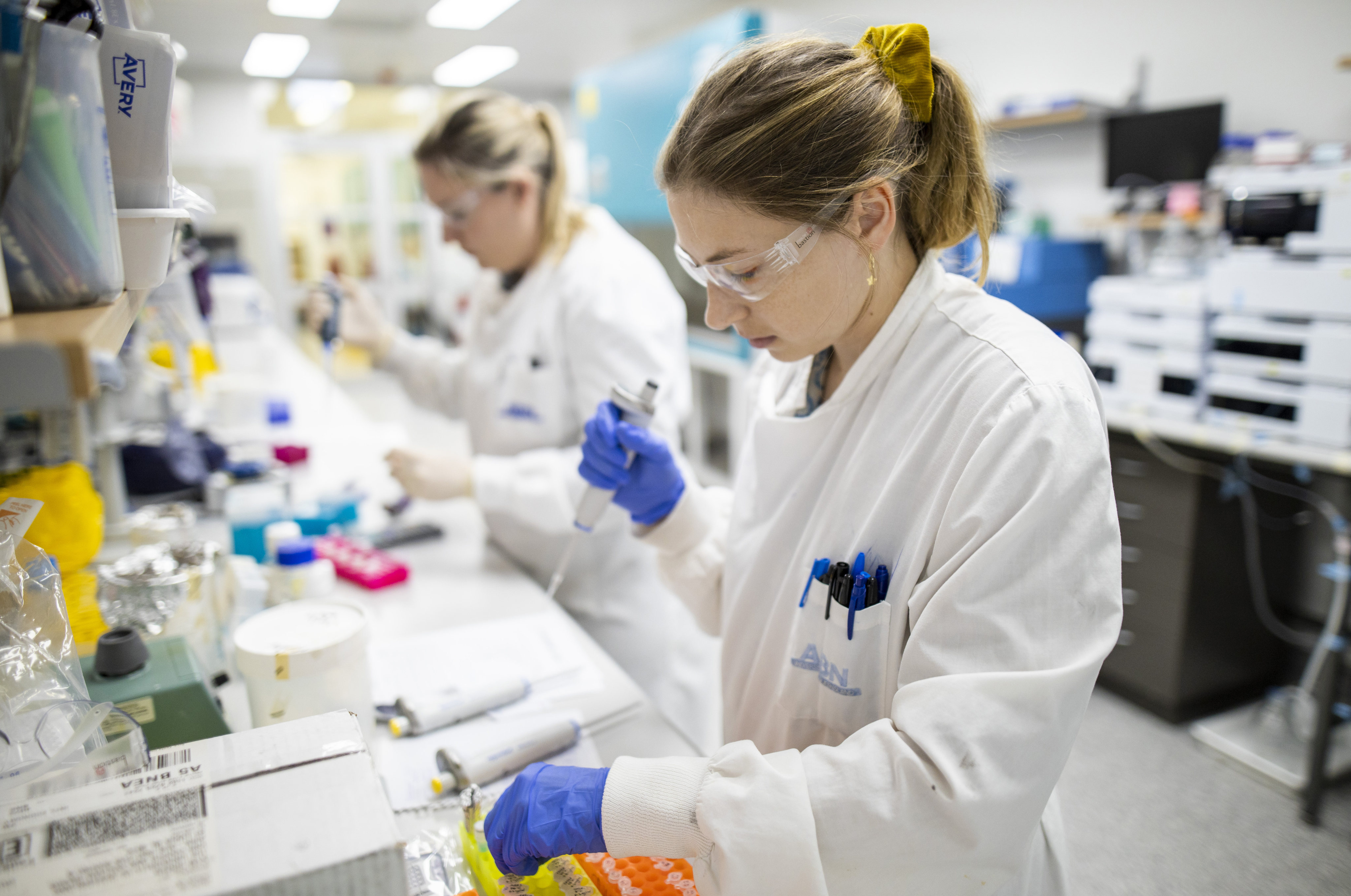 Researchers work in a lab at the University of Queensland, in Brisbane, Australia. Global challenges such as pandemics need global solutions. Photo: Handout