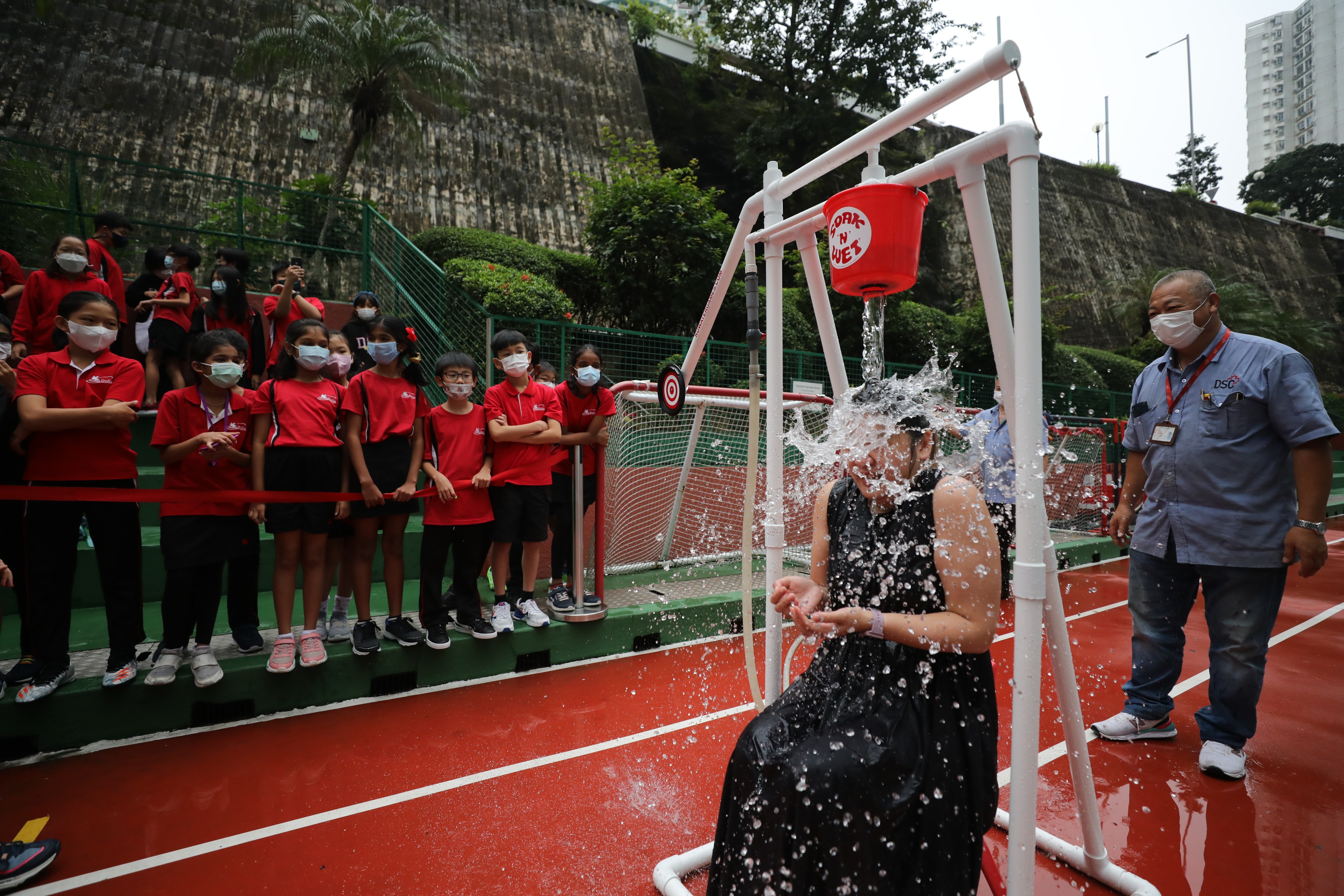 Wanda Wong, a teacher at DSC International School of Canada, takes part in the Dunk Tank Challenge to raise money for charity. Photo: Xiaomei Chen