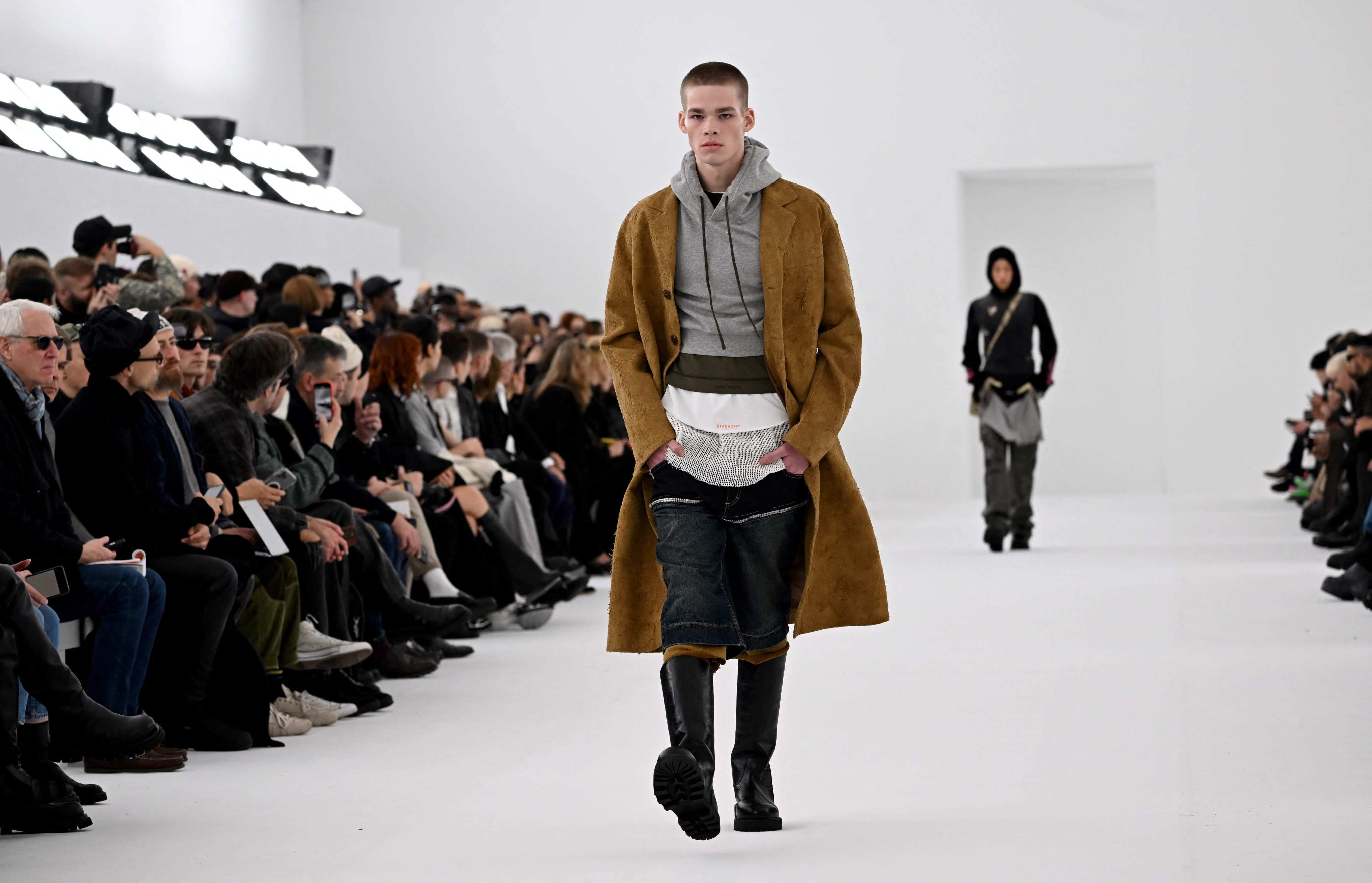 Paris Fashion Week 2023: 4 menswear highlights for AW23/24, from Emily in  Paris' Lucas Bravo on LGN's American Psycho-themed catwalk and Givenchy  minimalism, to Matrix-style coats with Saint Laurent
