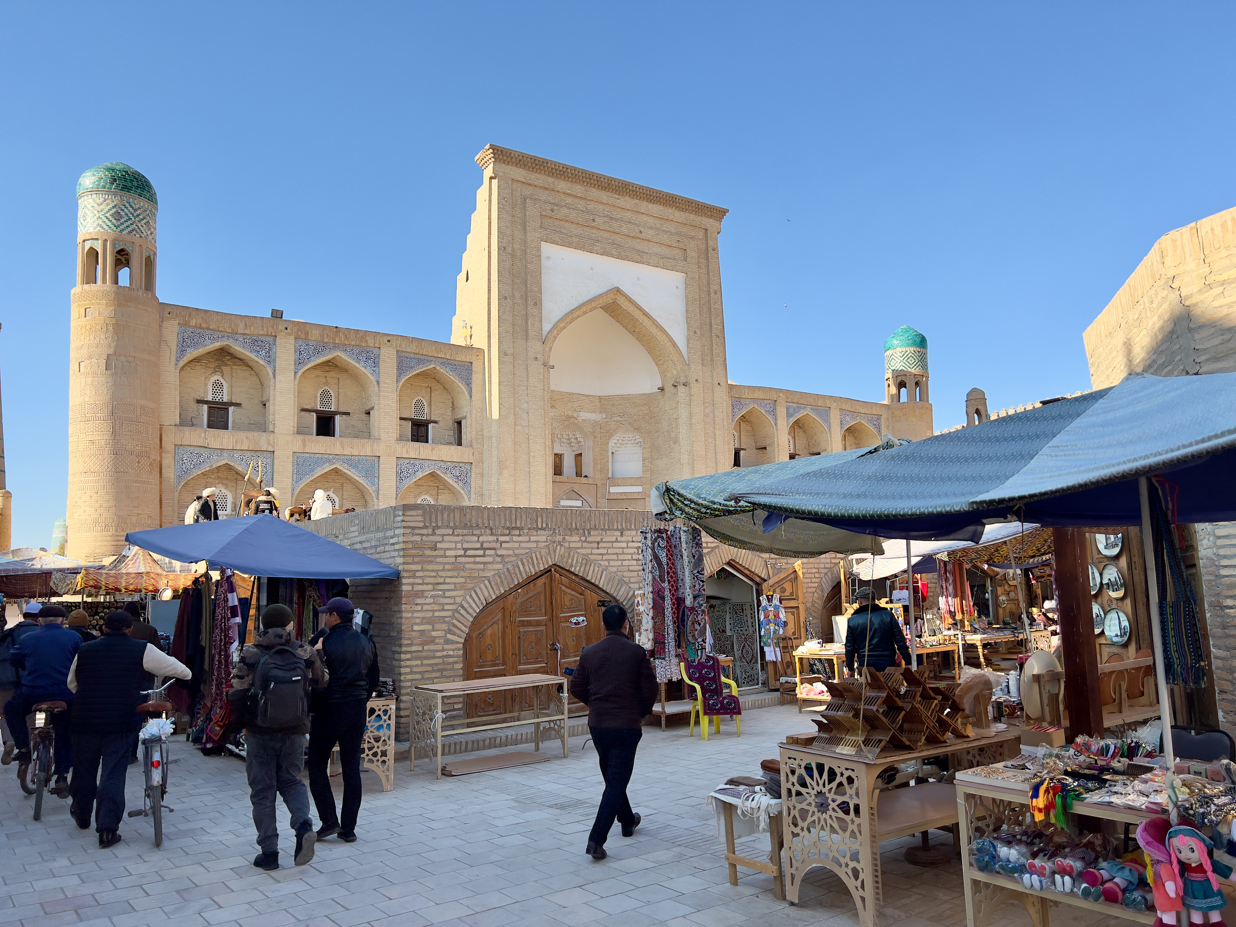 The warren of well-preserved streets in Uzbekistan’s ancient Khiva that weave between mosques and madrasas also function as a vast open-air souvenir marked in Uzbekistan, 2022. &#xA;&#xA;CREDIT:  Peter Neville-Hadley
