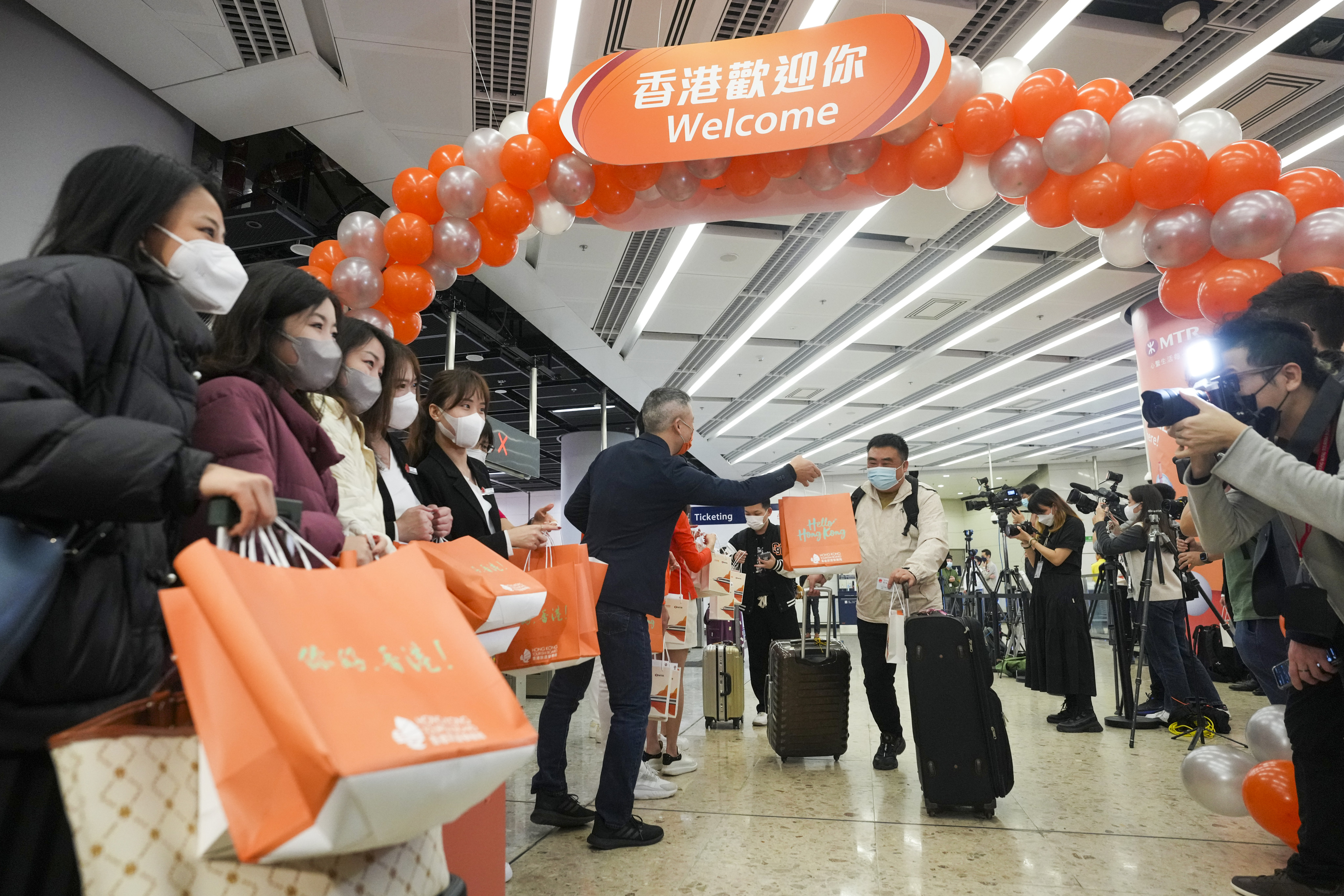 Passengers arrive at Hong Kong West Kowloon station on January 15, as high-speed rail services are resumed between the mainland and Hong Kong. Photo: Sam Tsang