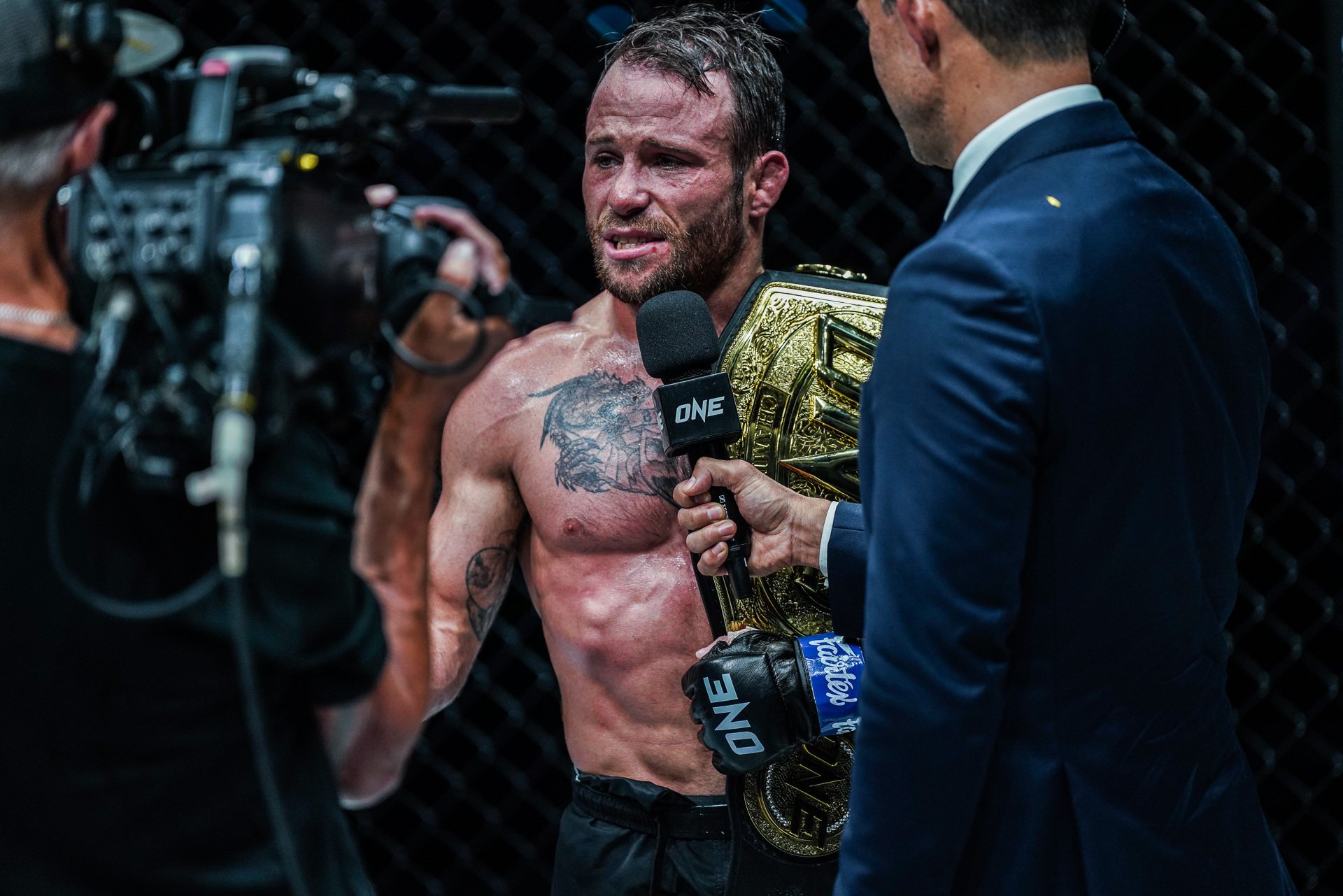 Jarred Brooks talks to Mitch Chilson after winning the ONE strawweight MMA title. Photo: ONE Championship