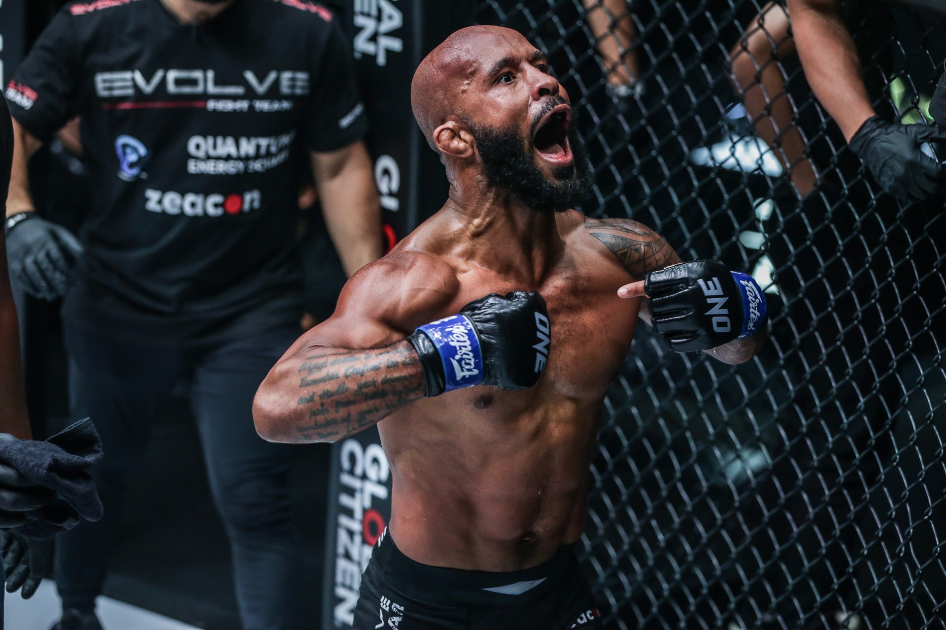 Demetrious Johnson celebrates winning the ONE flyweight MMA title. Photos: ONE Championship