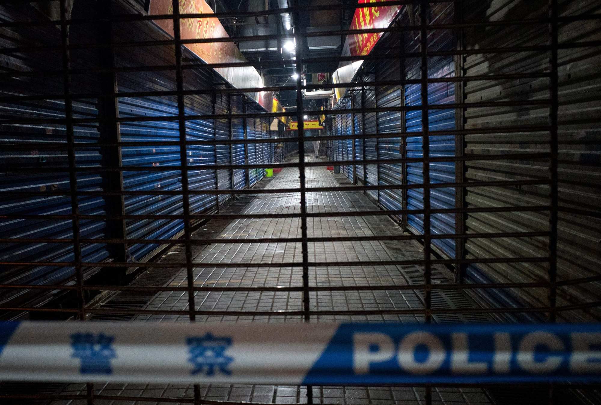 Wuhan Hygiene Emergency Response Team members search the closed Huanan Seafood Wholesale Market in Wuhan in January 2020. Photo: AFP