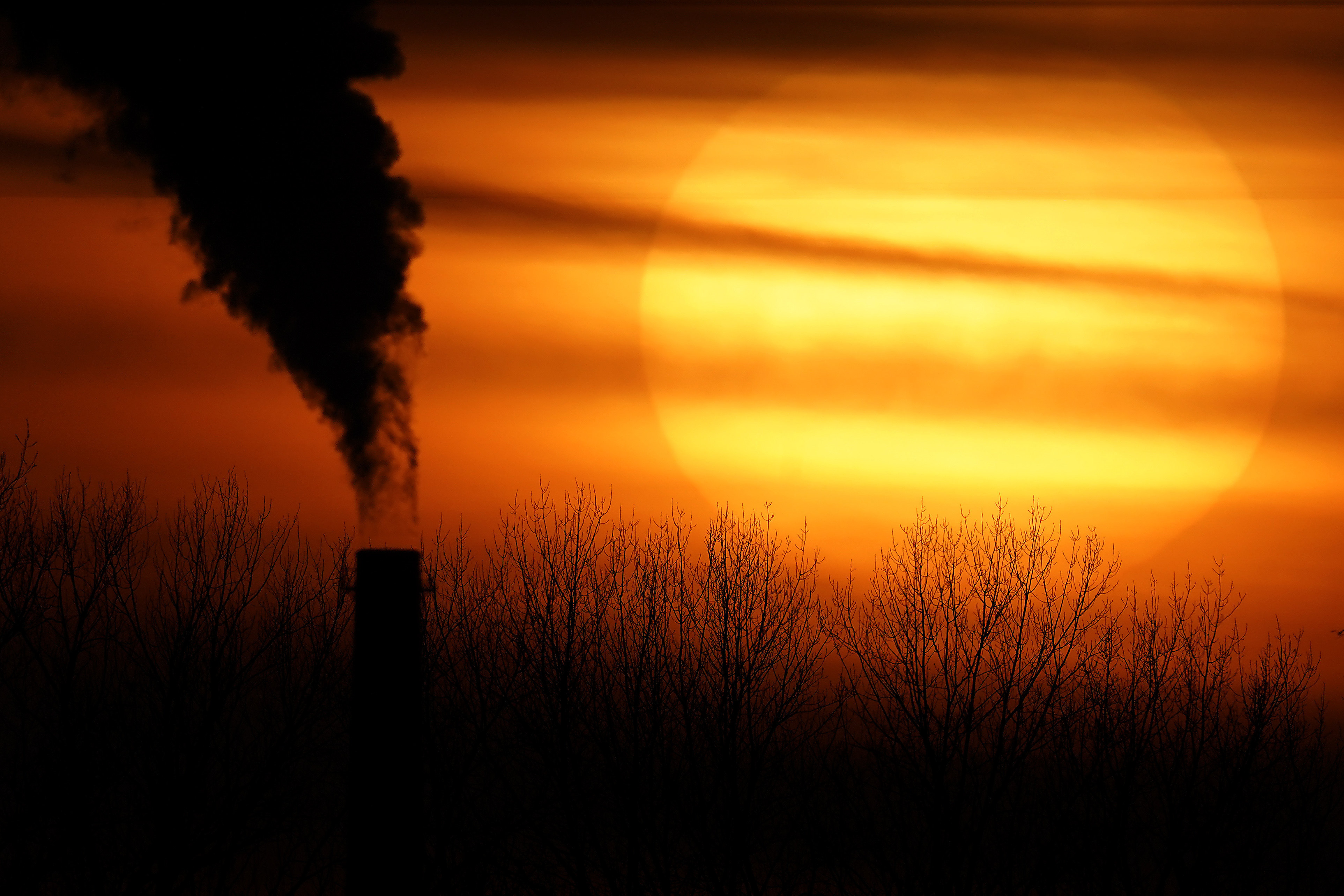 Greenhouse gas emissions from many sources including power plants are contributing to global warming. Photo: AP