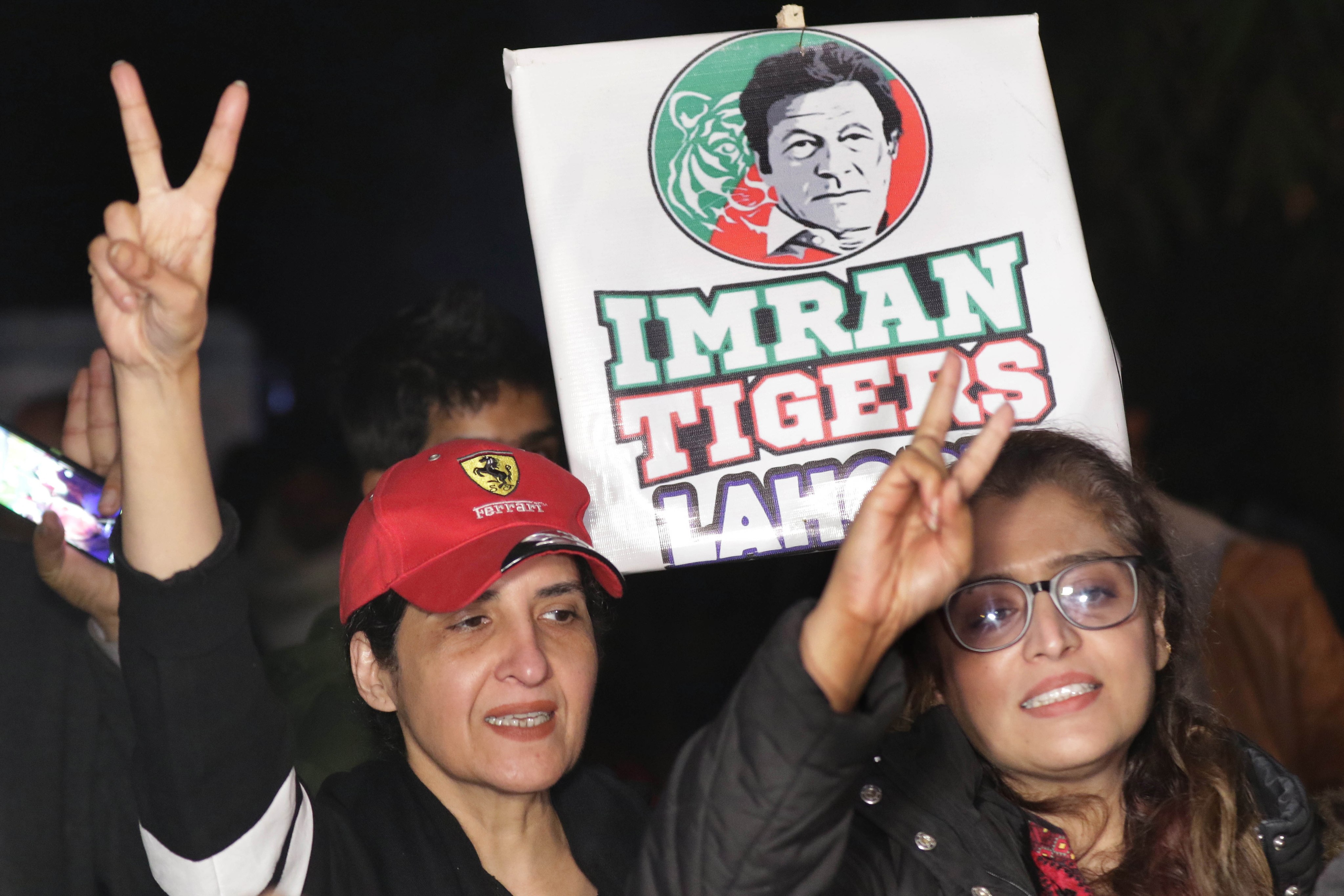 Supporters of Pakistan’s former Prime Minister Imran Khan gather after the arrest of the party’s senior vice president Fawad Chaudhy. Photo: EPA-EFE