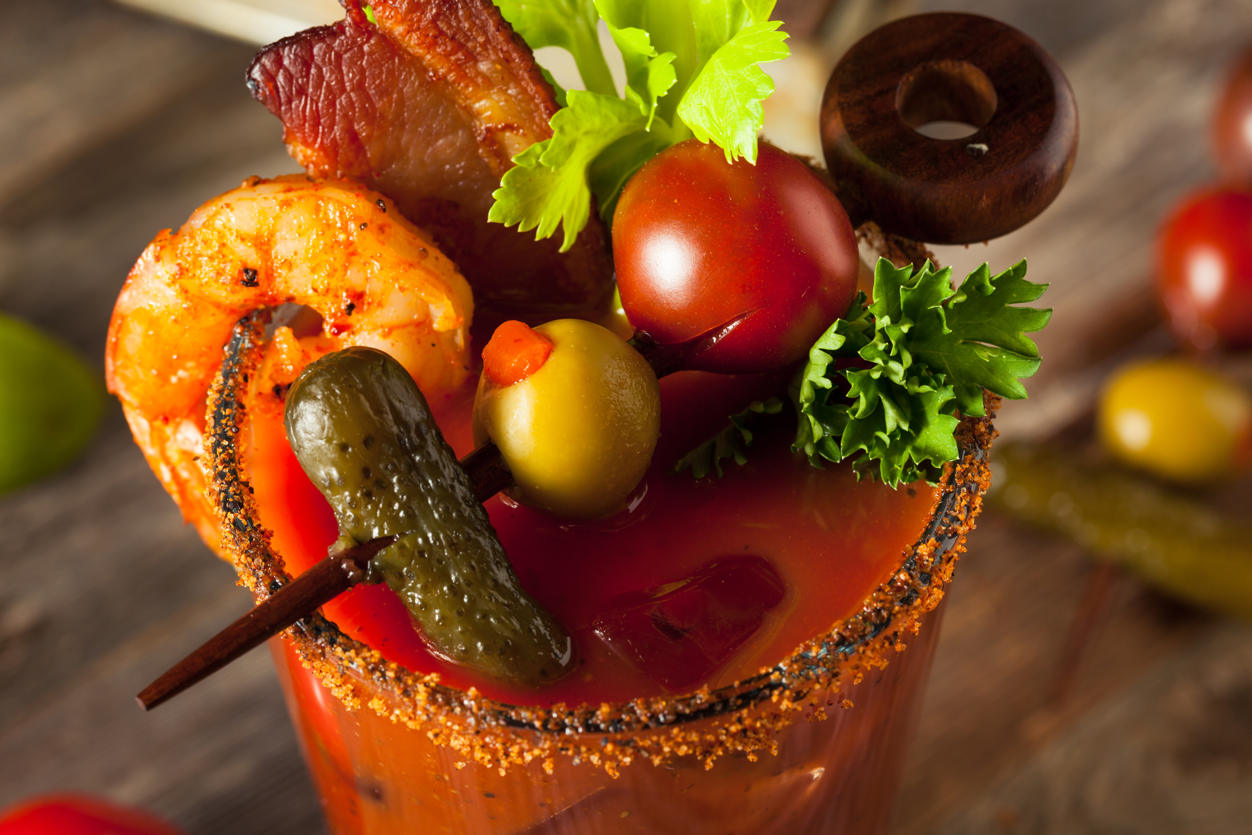 Drink trends for the coming year include more savoury cocktails, such as this bacon spicy Bloody Mary with shrimp, pickle and olive, classic cocktails, and grower champagnes. Falling out of favour, we hope, will be cristalinos – clarified aged tequilas – and so-called healthy spirits. Photo: Shutterstock
