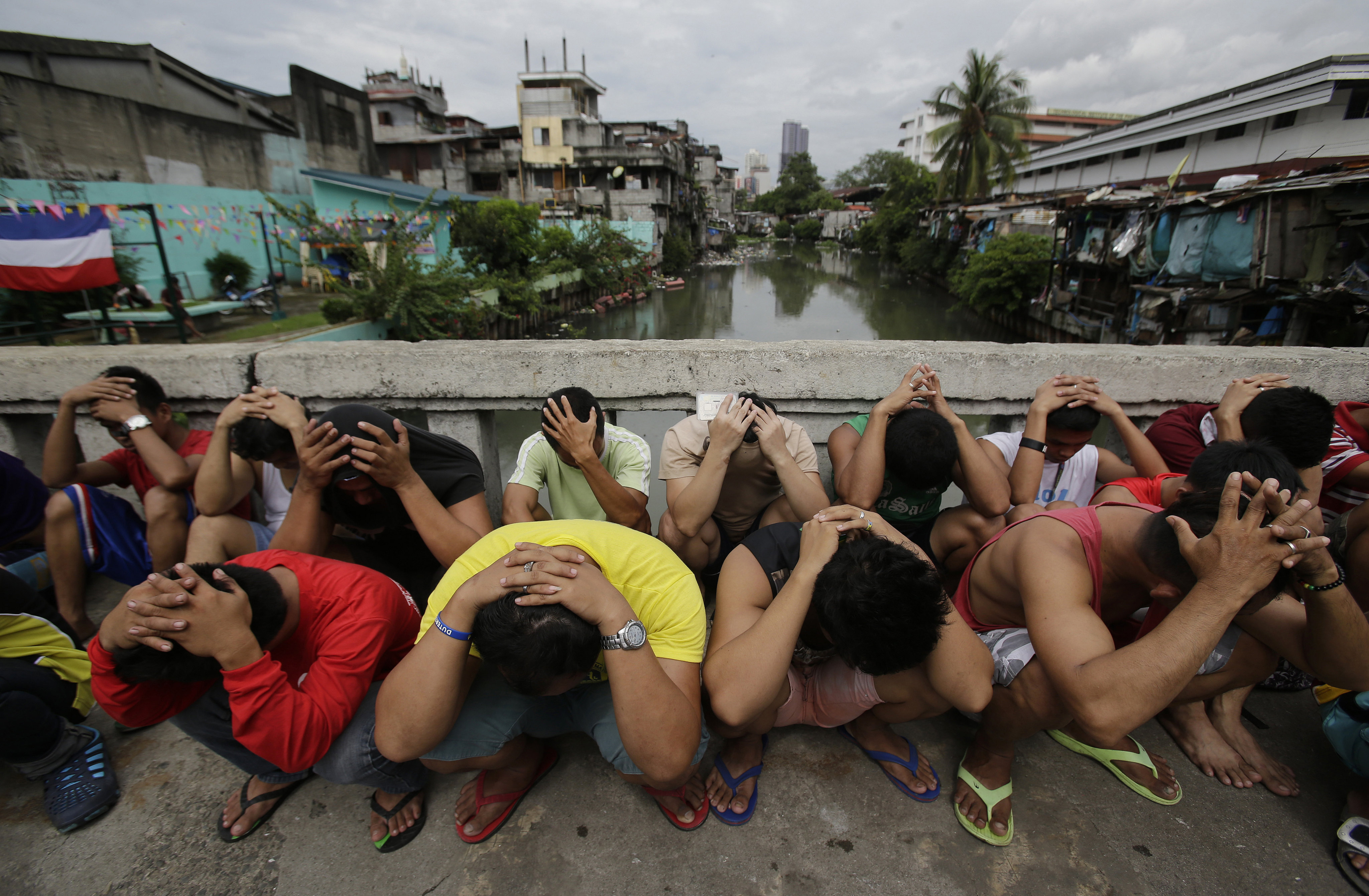 Filipino men rounded up during the “War on Drugs” campaign of former President Rodrigo Duterte. Photo: AP