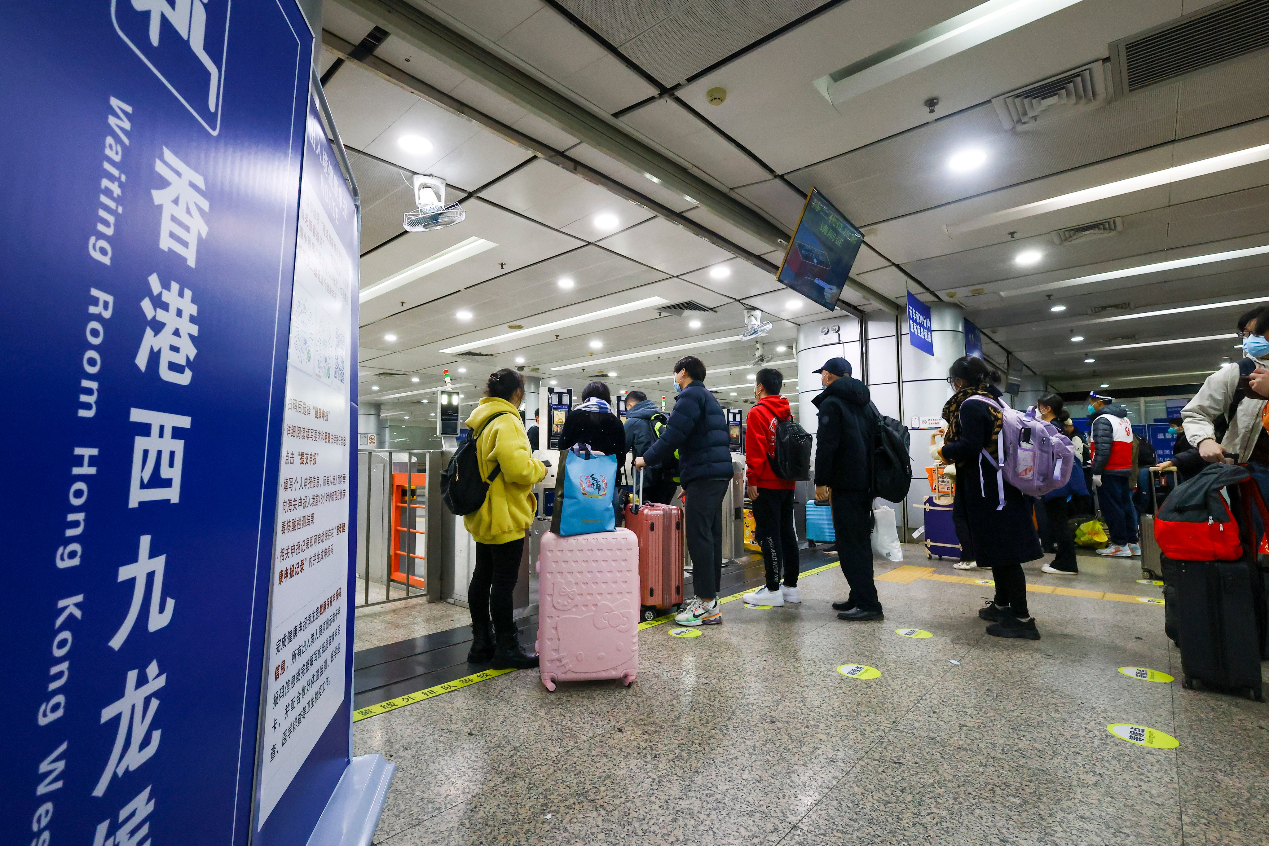 Travellers at a train station in Guangzhou wait to board a ride to Hong Kong. Photo: Dickson Lee
