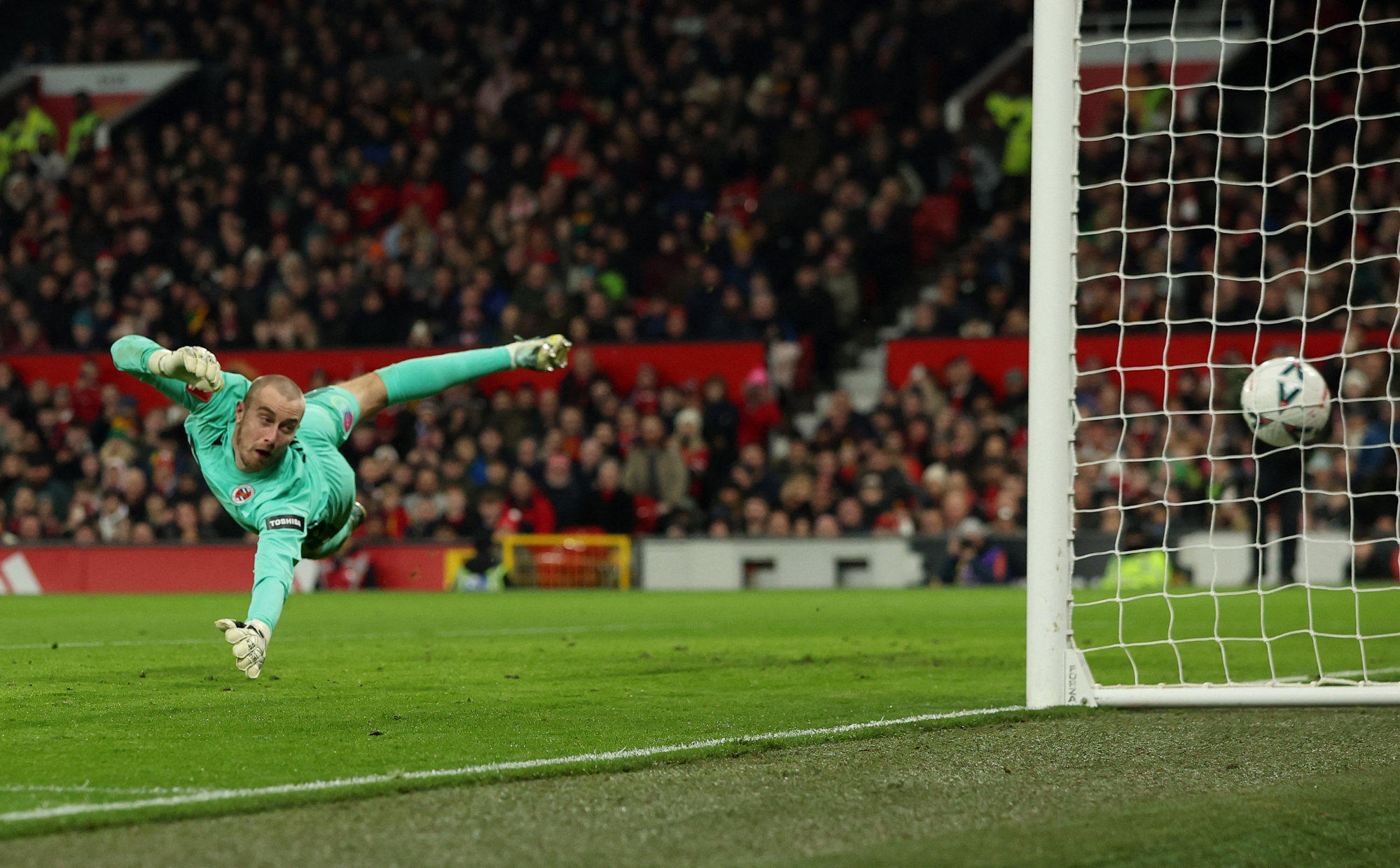 Manchester United’s Casemiro scores their second goal past Reading’s Joe Lumley. Photo: Reuters