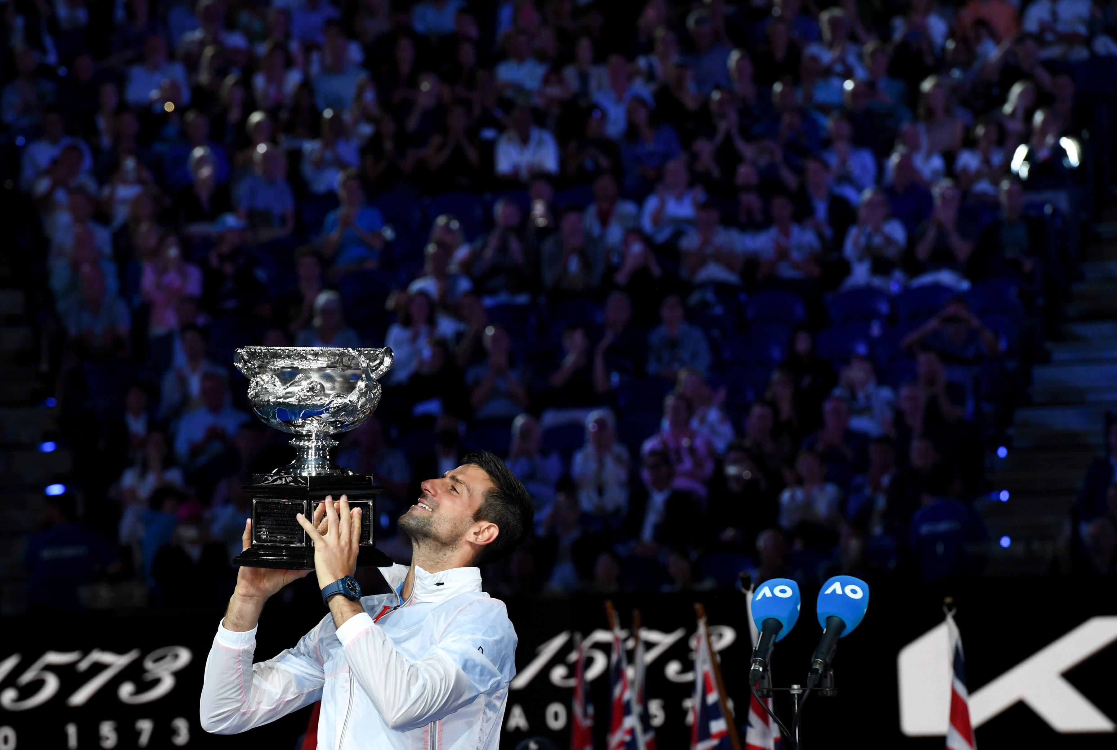 Novak Djokovic poses with his trophy after the men’s singles final at the Australian Open. Photo: Xinhua