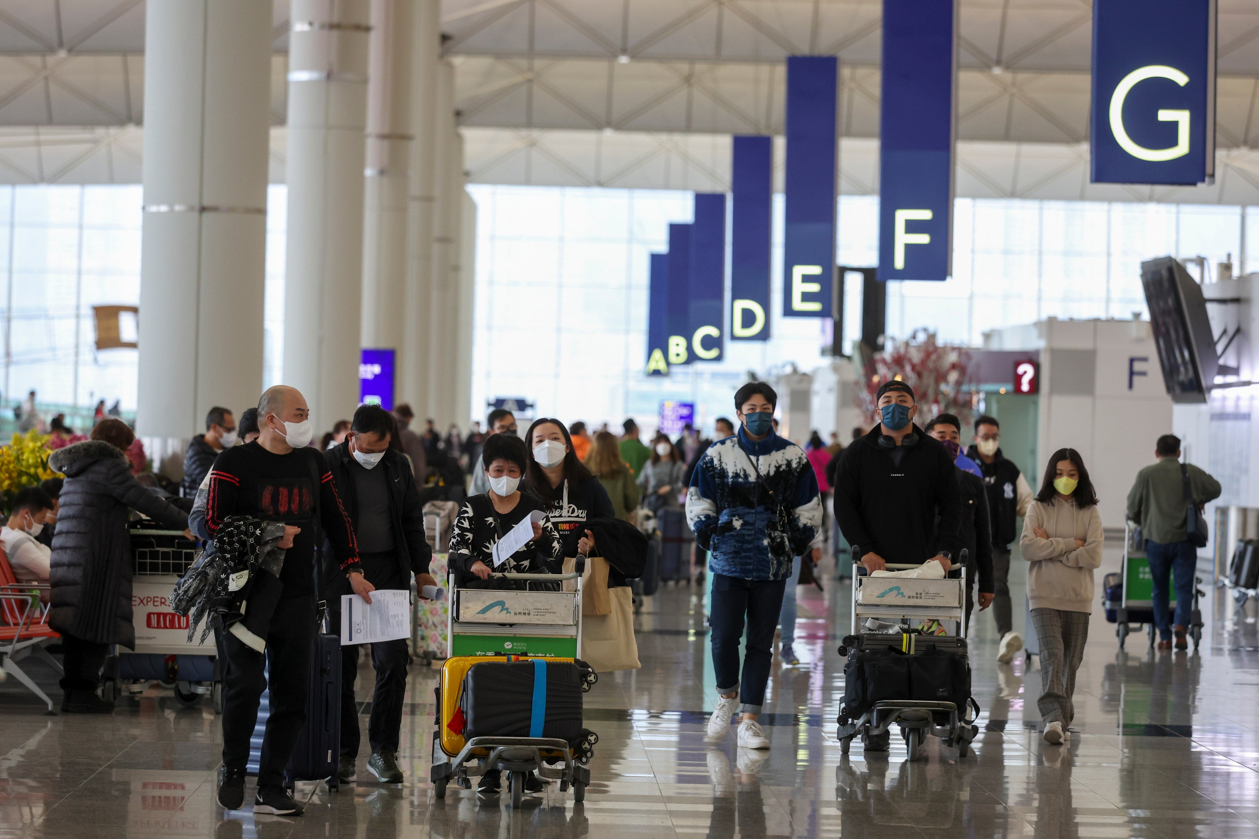 Passengers at the departure hall of Hong Kong International Airport. Psychologists say migrants often face challenges in finding housing and employment overseas. Photo: Yik Yeung-man