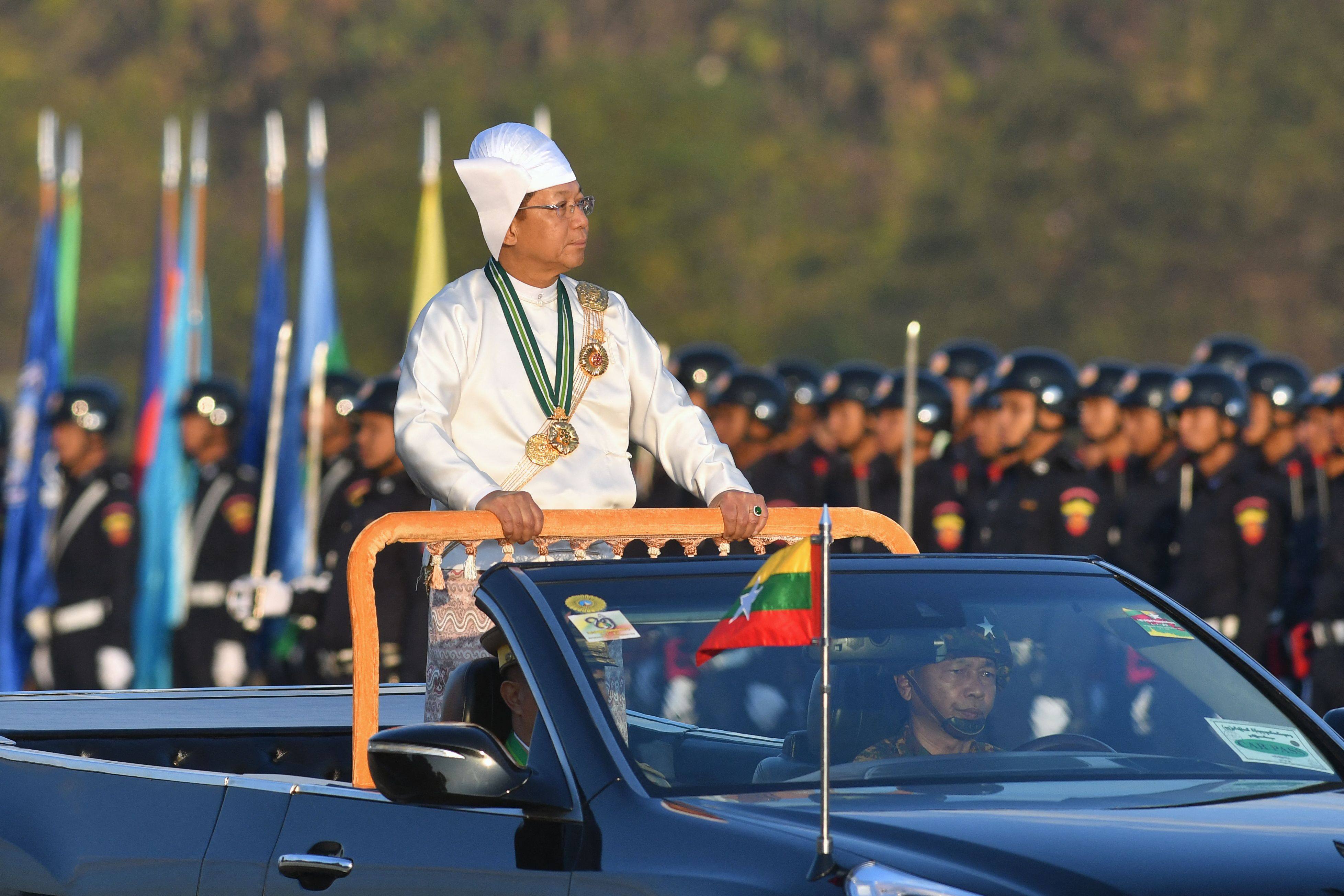 Myanmar’s military chief Min Aung Hlaing stands in a car as he oversees a military display to mark the country’s Independence Day in Naypyidaw earlier this month. Photo: AFP