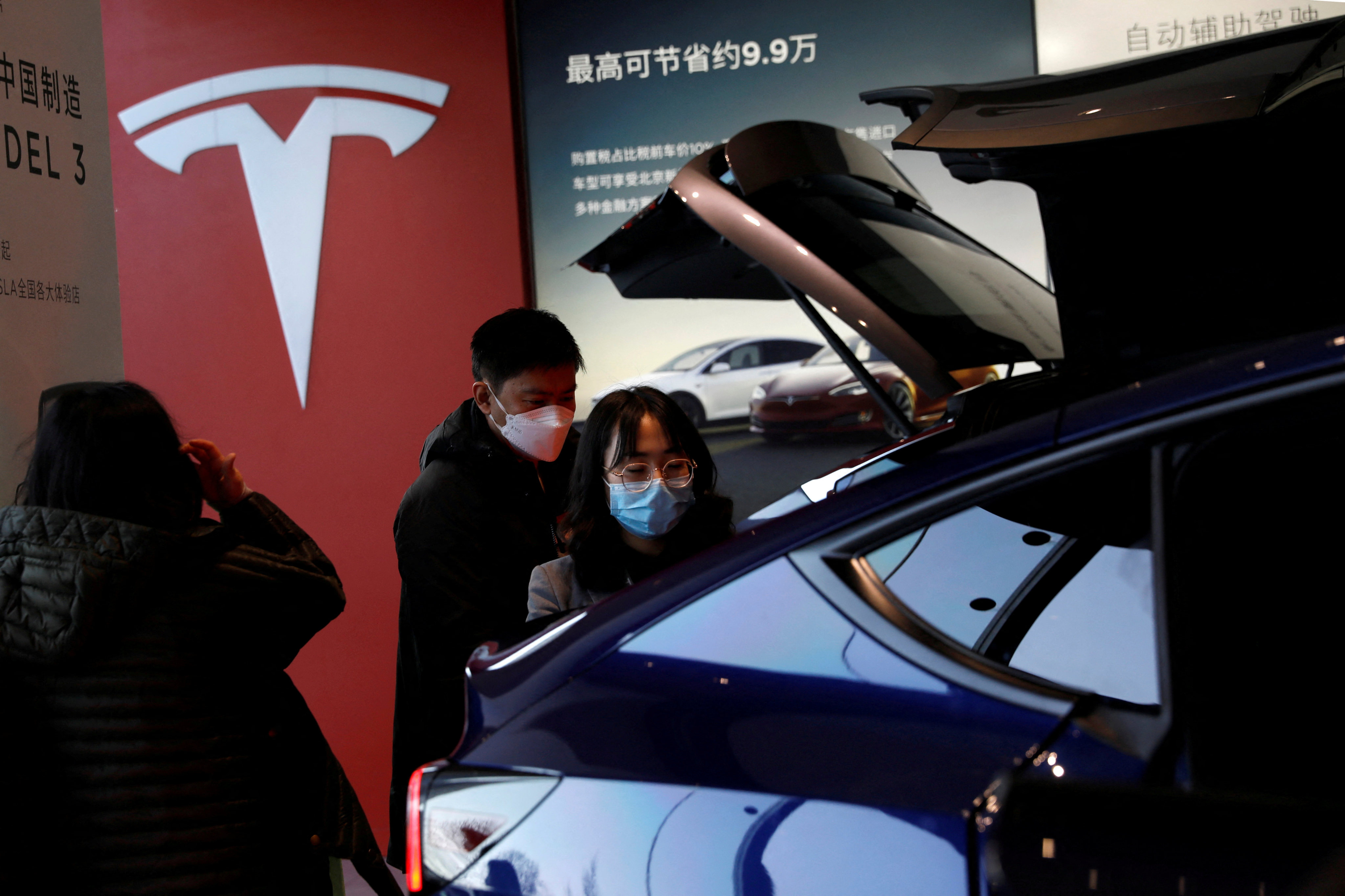 Visitors inspect a Tesla Model Y sport utility vehicle at the electric vehicle maker’s showroom in Beijing on January 5, 2021. China is the front-runner in the electric vehicle market at the moment, but the space for innovation and adaptation mean its dominance is not assured. Photo: Reuters