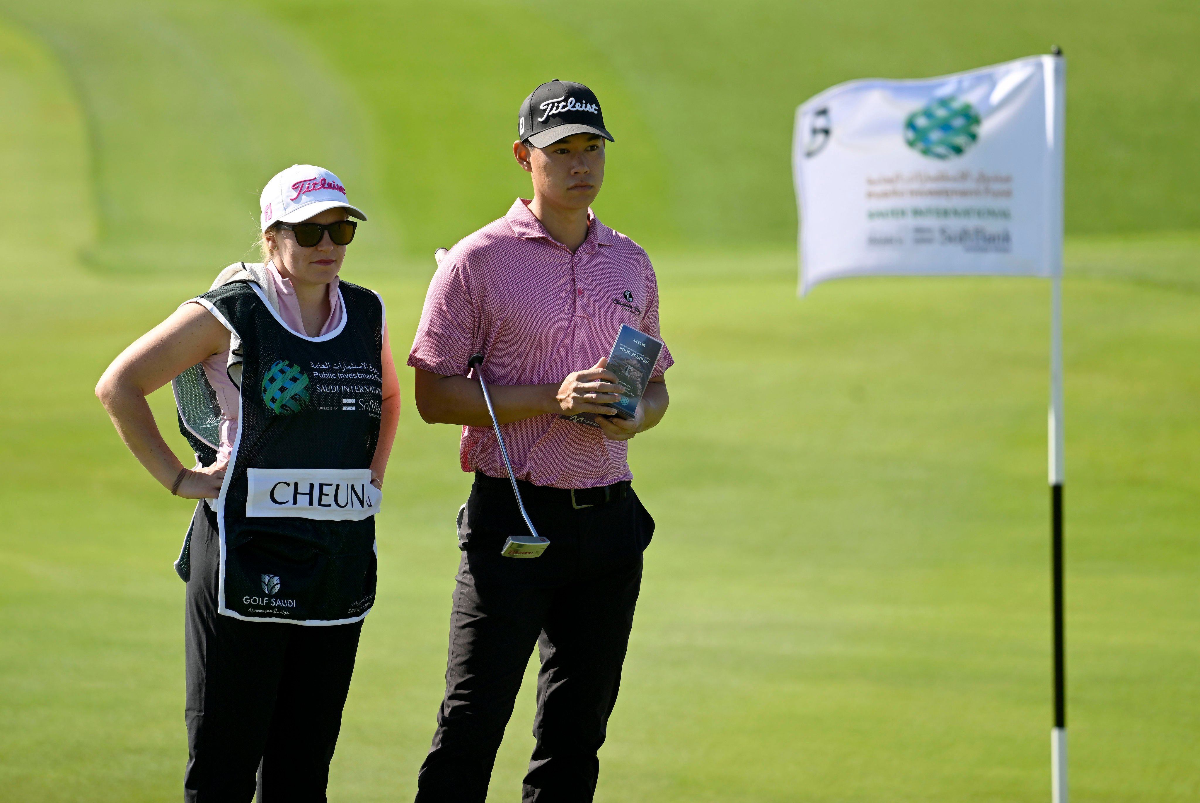 Kaitlin Cheung (left) and husband Matthew Cheung wait on the 5th green during the first round of the PIF Saudi International. Photo: Asian Tour.