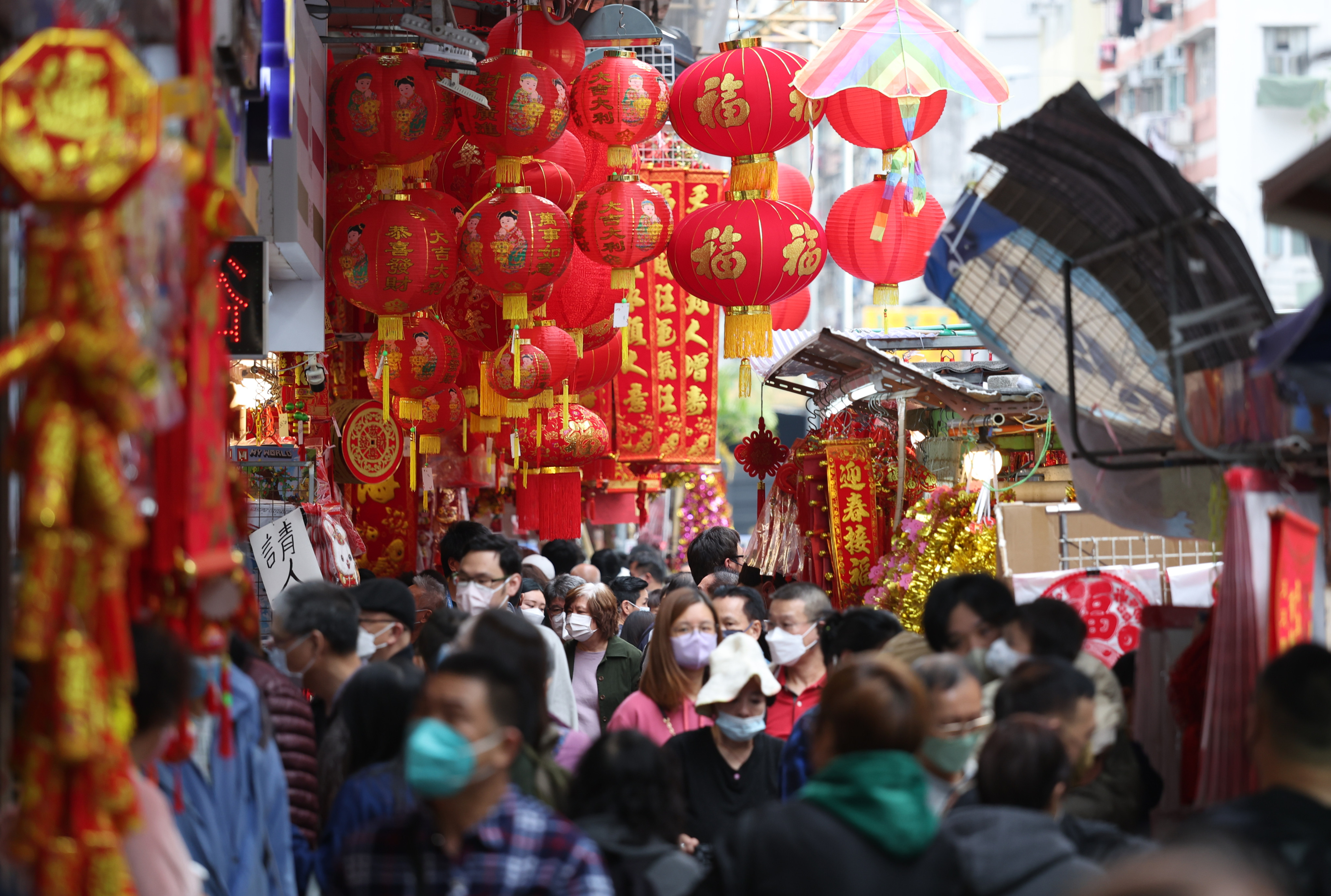 Crowds walk past Lunar New Year decorations in Hong Kong’s Sham Shui Po district on January 2. Photo: Yik Yeung-man