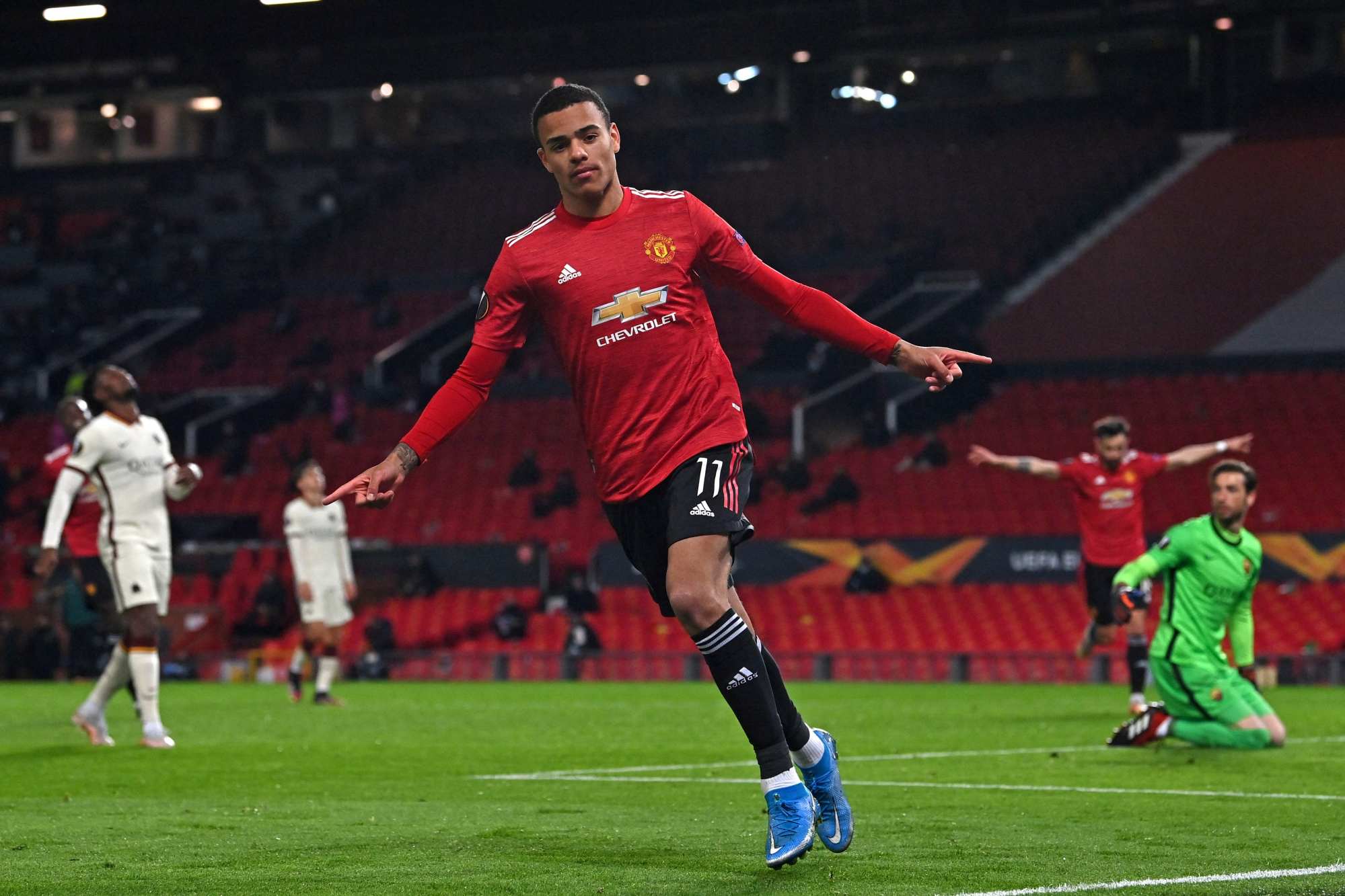 Manchester United striker Mason Greenwood celebrates after scoring their sixth goal against Roma at Old Trafford. Photo: AFP