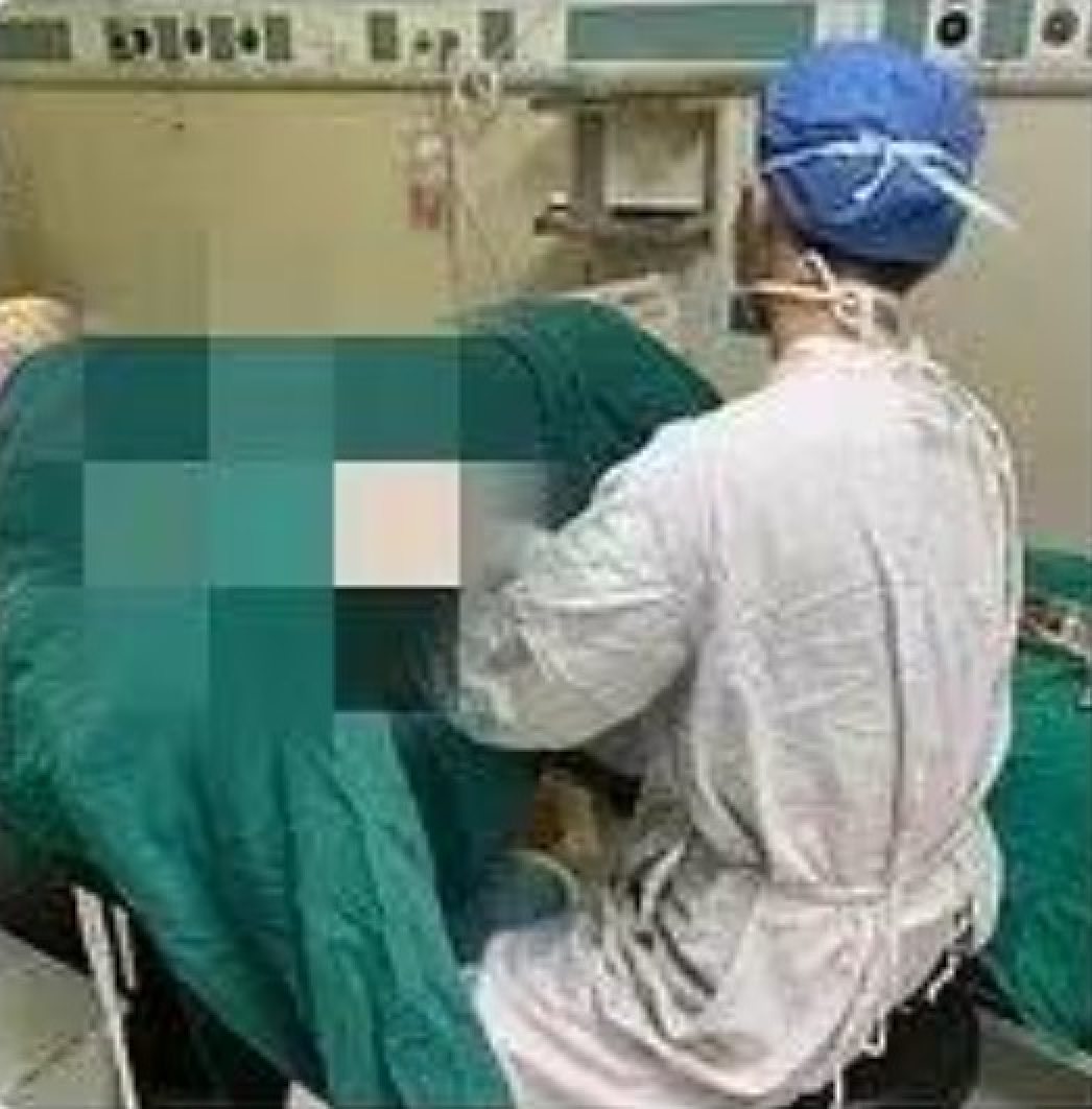Doctor suspended for posting photo online of him examining female ...