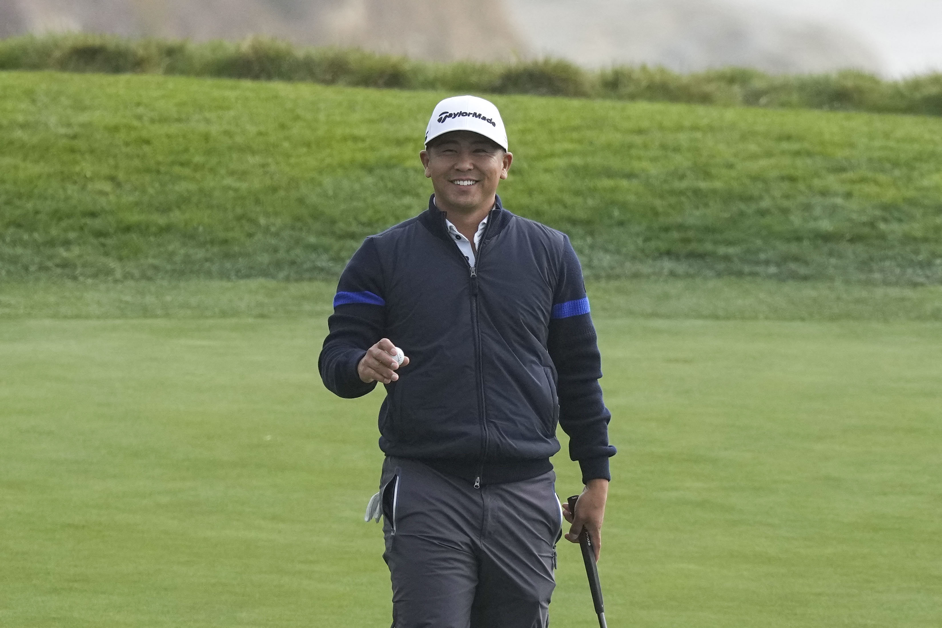 Kurt Kitayama acknowledges the crowds after making his putt on the ninth hole during the second round of the AT&T Pebble Beach Pro-Am. Photo: USA TODAY Sports