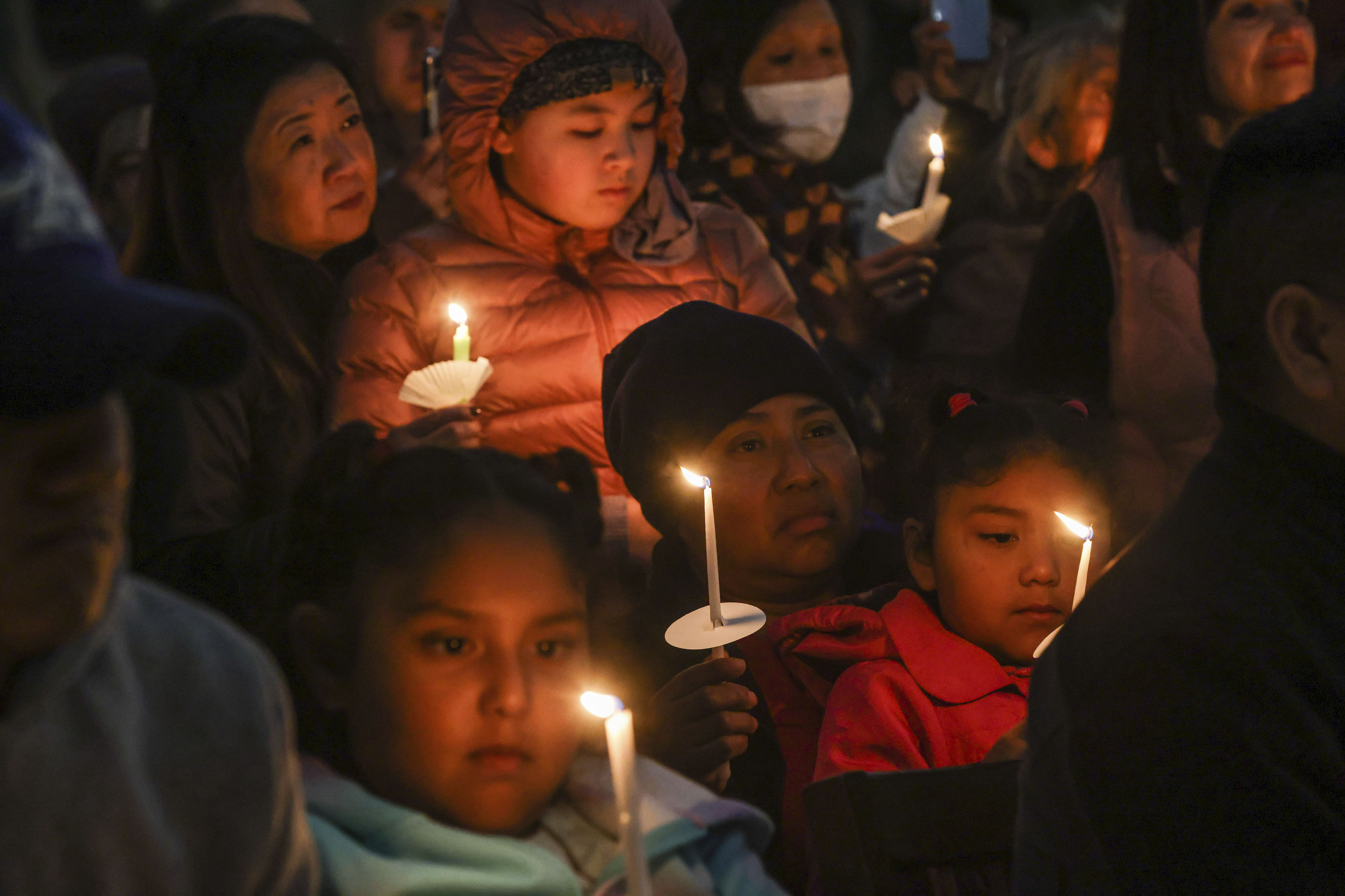 People gather at a vigil in Half Moon Bay, California, on January 27, days after a mass shooting took place at two farms in the community. Photo: San Francisco Chronicle via AP