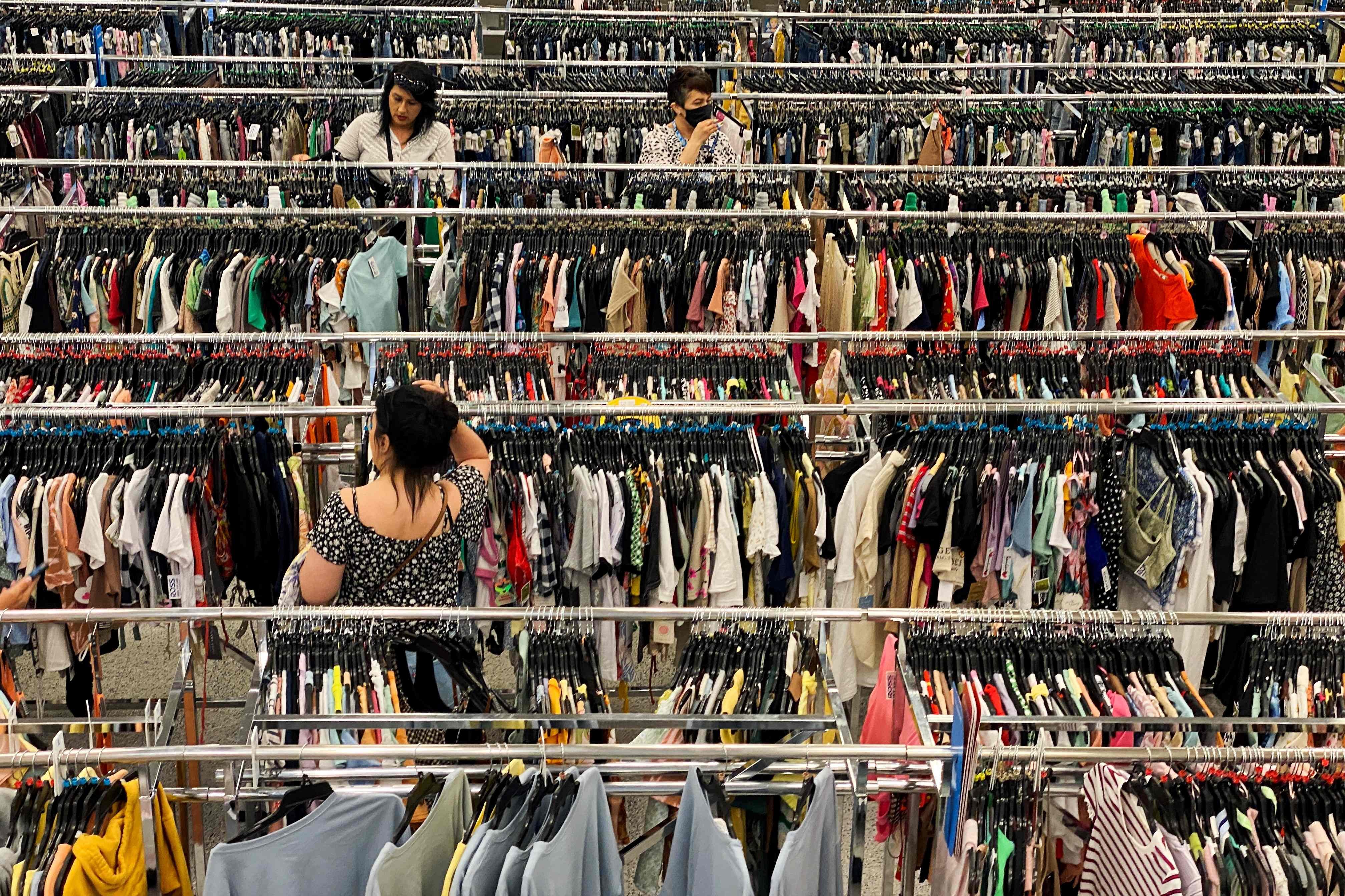 Customers browse racks of clothing at a discount shop in Las Vegas, Nevada, US, In May 2022. Photo: AFP